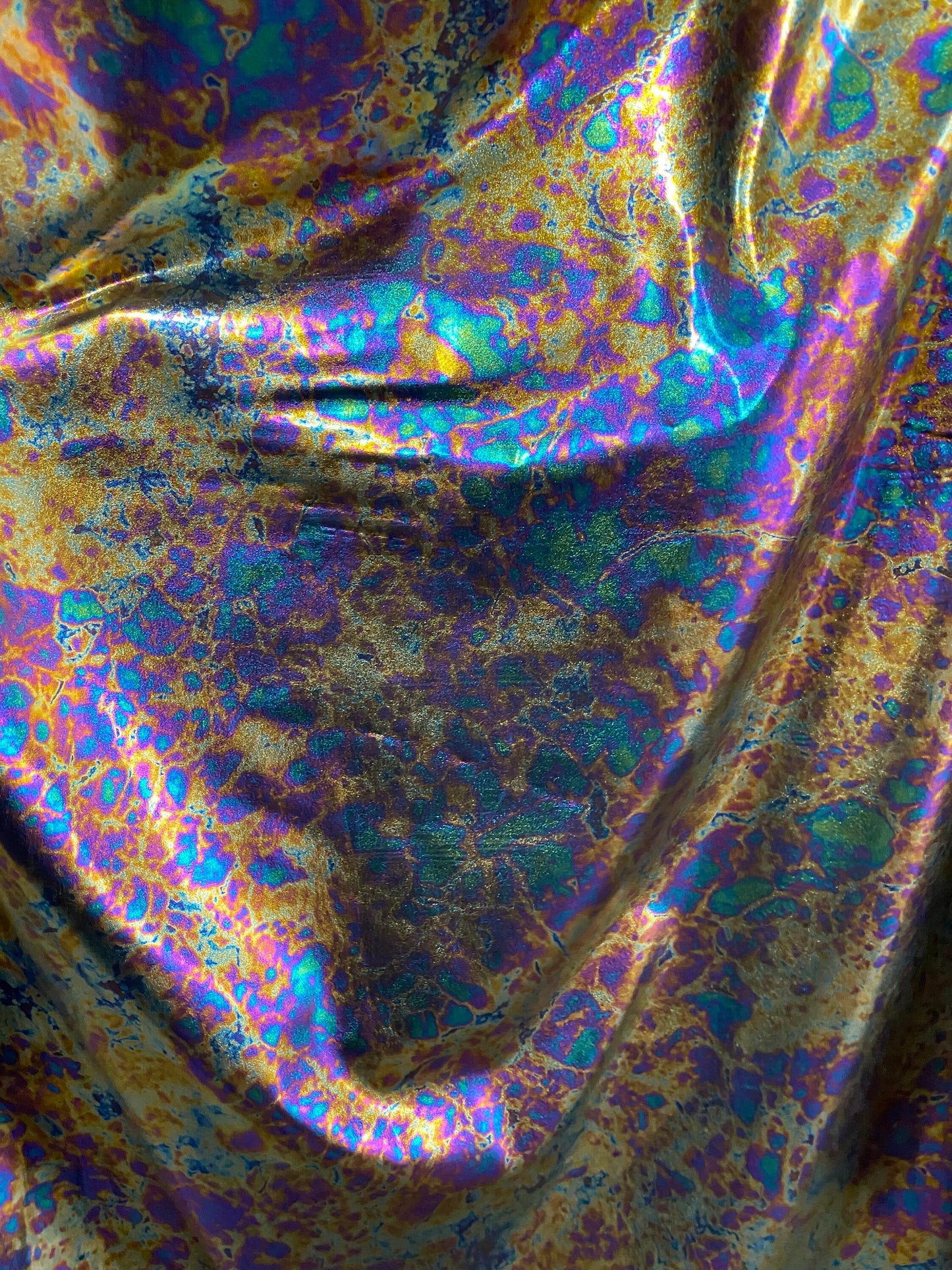New Modern Lava design oil effect metallic nylon spandex all over foil 4-way 58/60” Sold by the YD. Ships worldwide from Los Angeles CA USA.