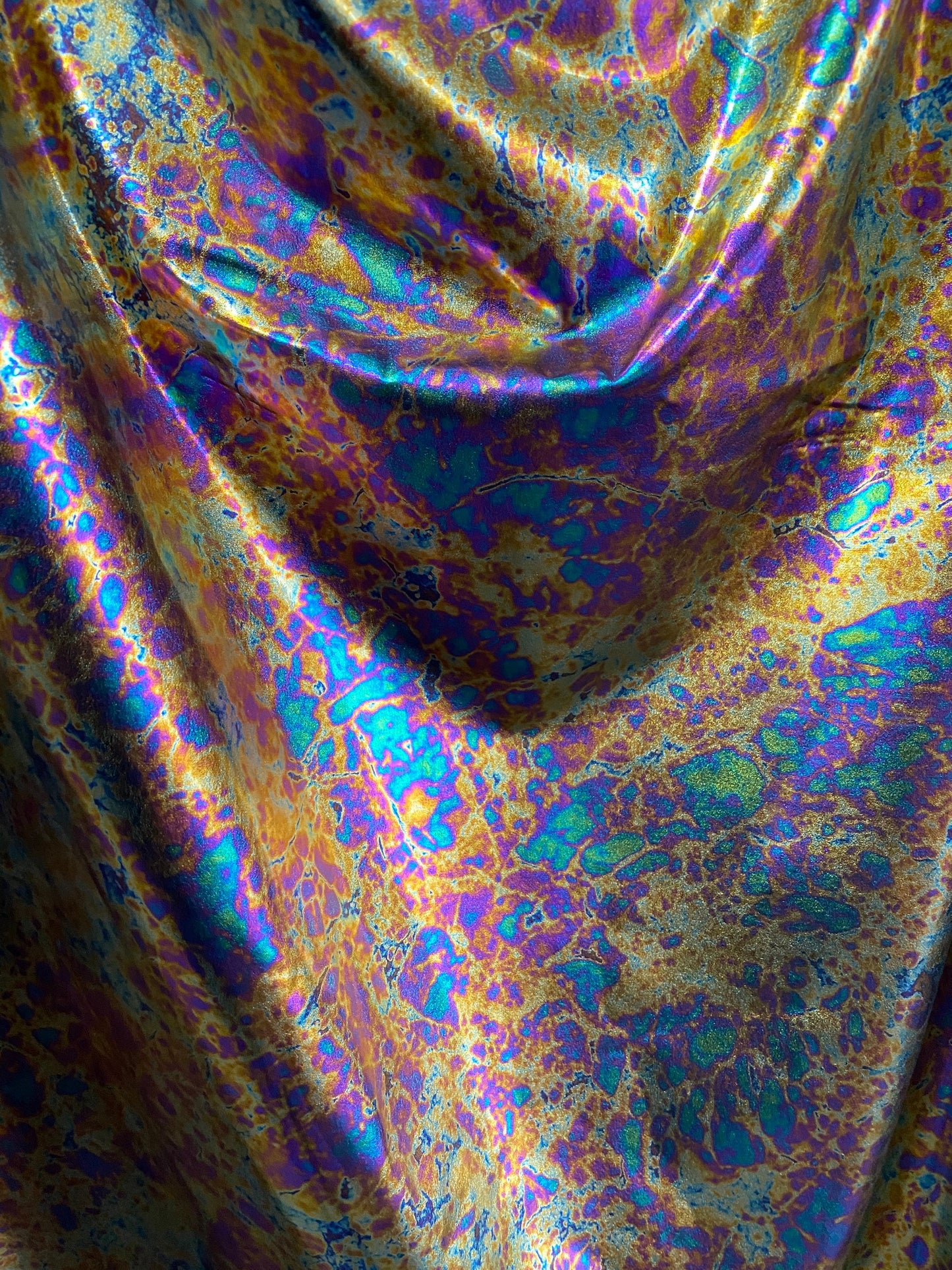 New Modern Lava design oil effect metallic nylon spandex all over foil 4-way 58/60” Sold by the YD. Ships worldwide from Los Angeles CA USA.