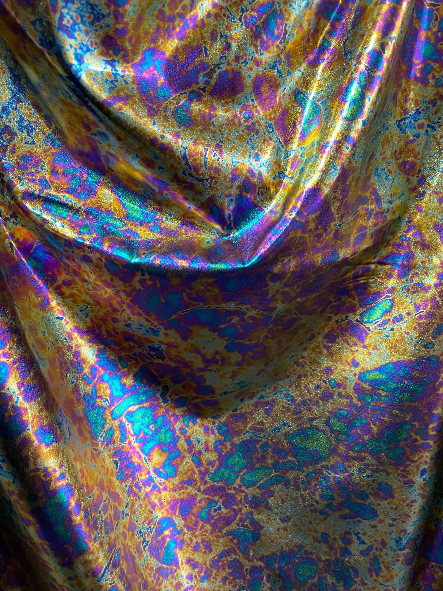 New Modern Lava design oil effect metallic nylon spandex all over foil 4-way 58/60” Sold by the YD. Ships worldwide from Los Angeles CA USA.