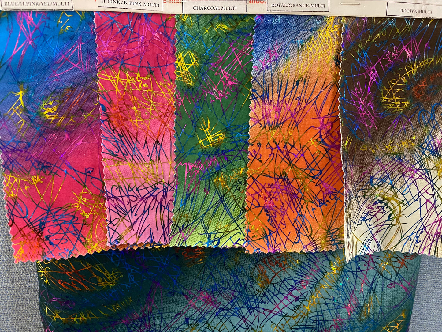 New tie dye Bang bang hologram foil print in nylon spandex 4way stretch 58/60” Sold by the YD. Ships worldwide from Los Angeles CA.