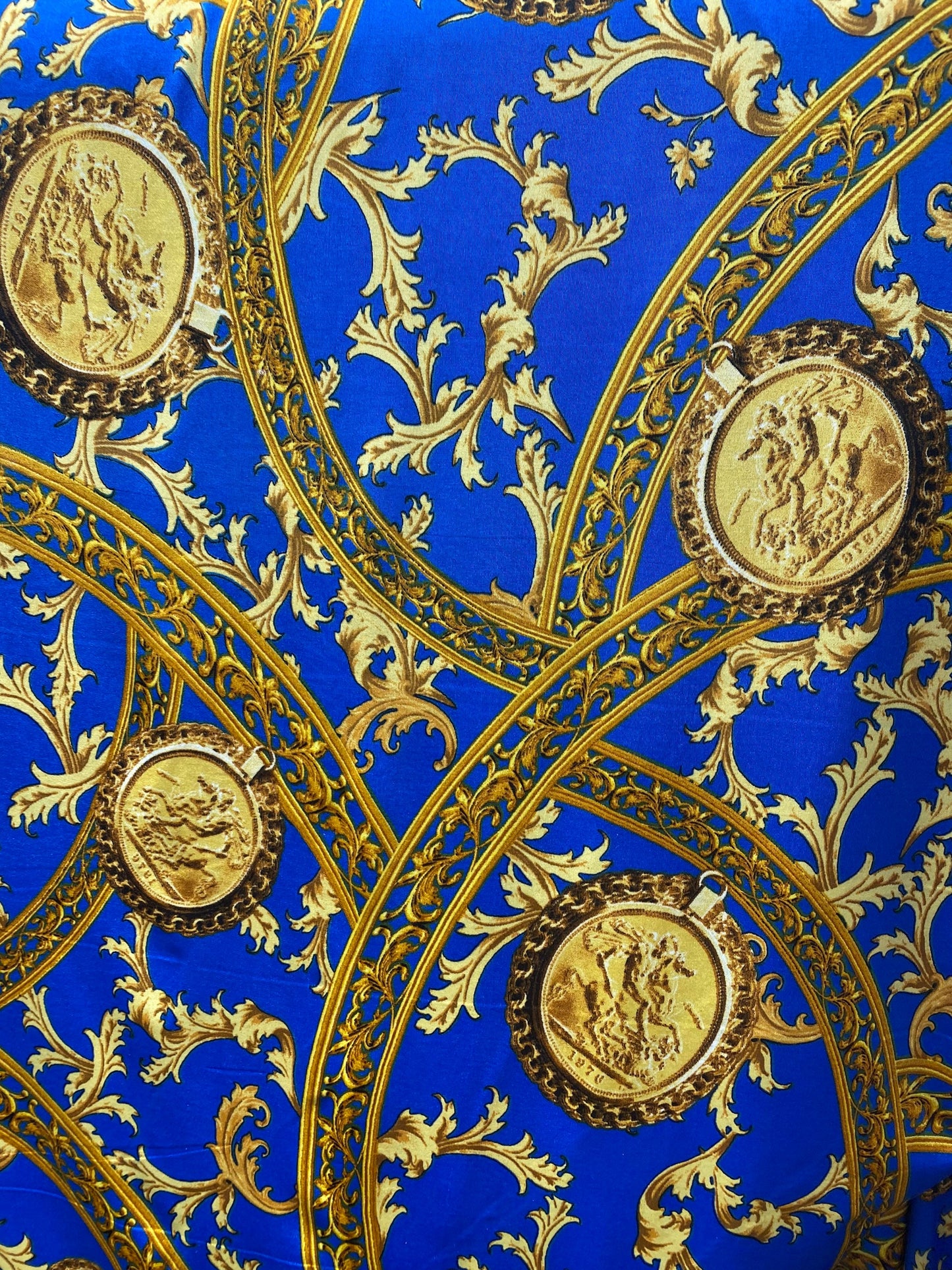 New modern print Sapphire/gold poly spandex medium weight 4-way stretch 58/60” Sold by the YD. Ships worldwide from Los Ángeles California.