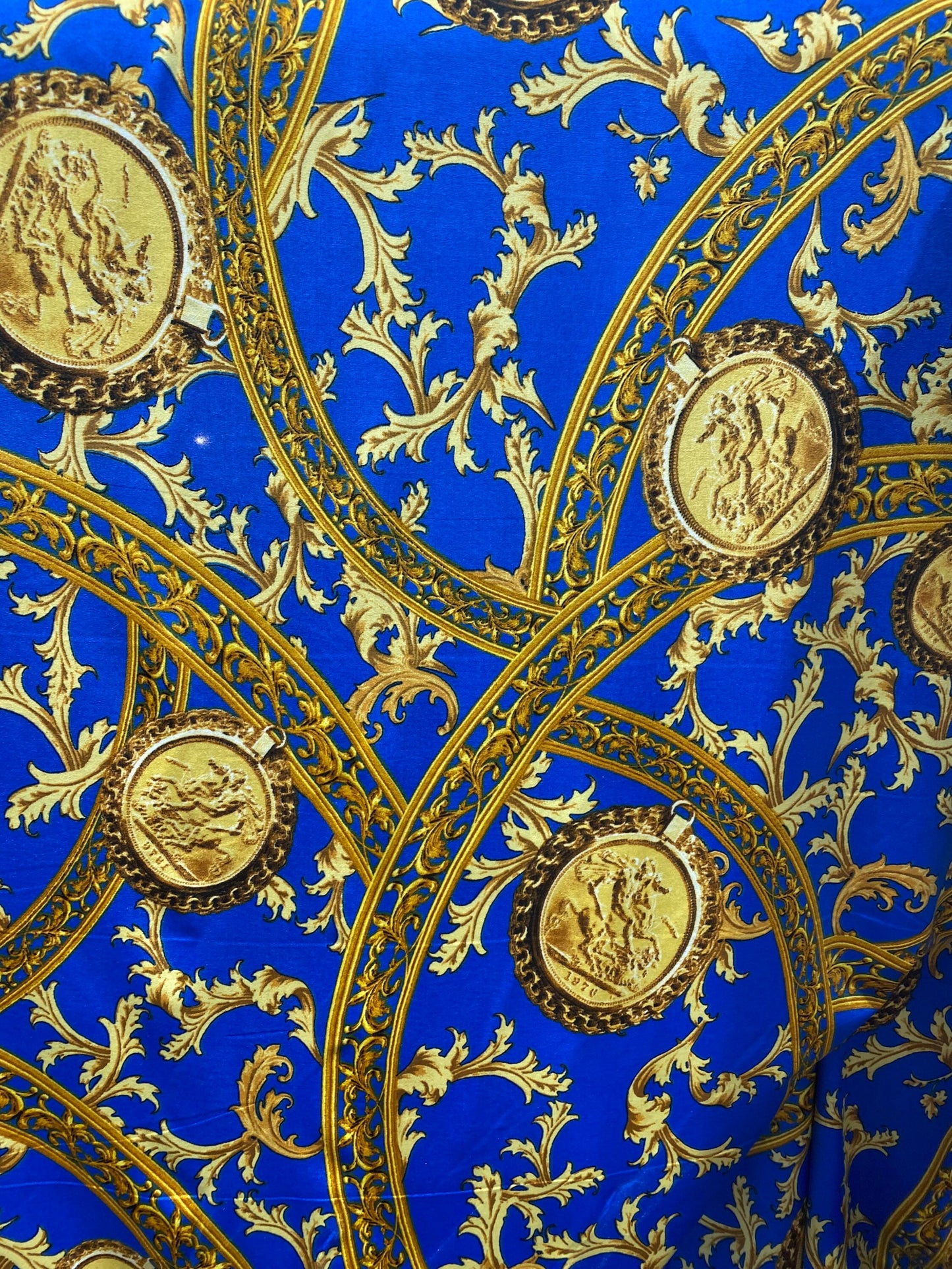 New modern print Sapphire/gold poly spandex medium weight 4-way stretch 58/60” Sold by the YD. Ships worldwide from Los Ángeles California.