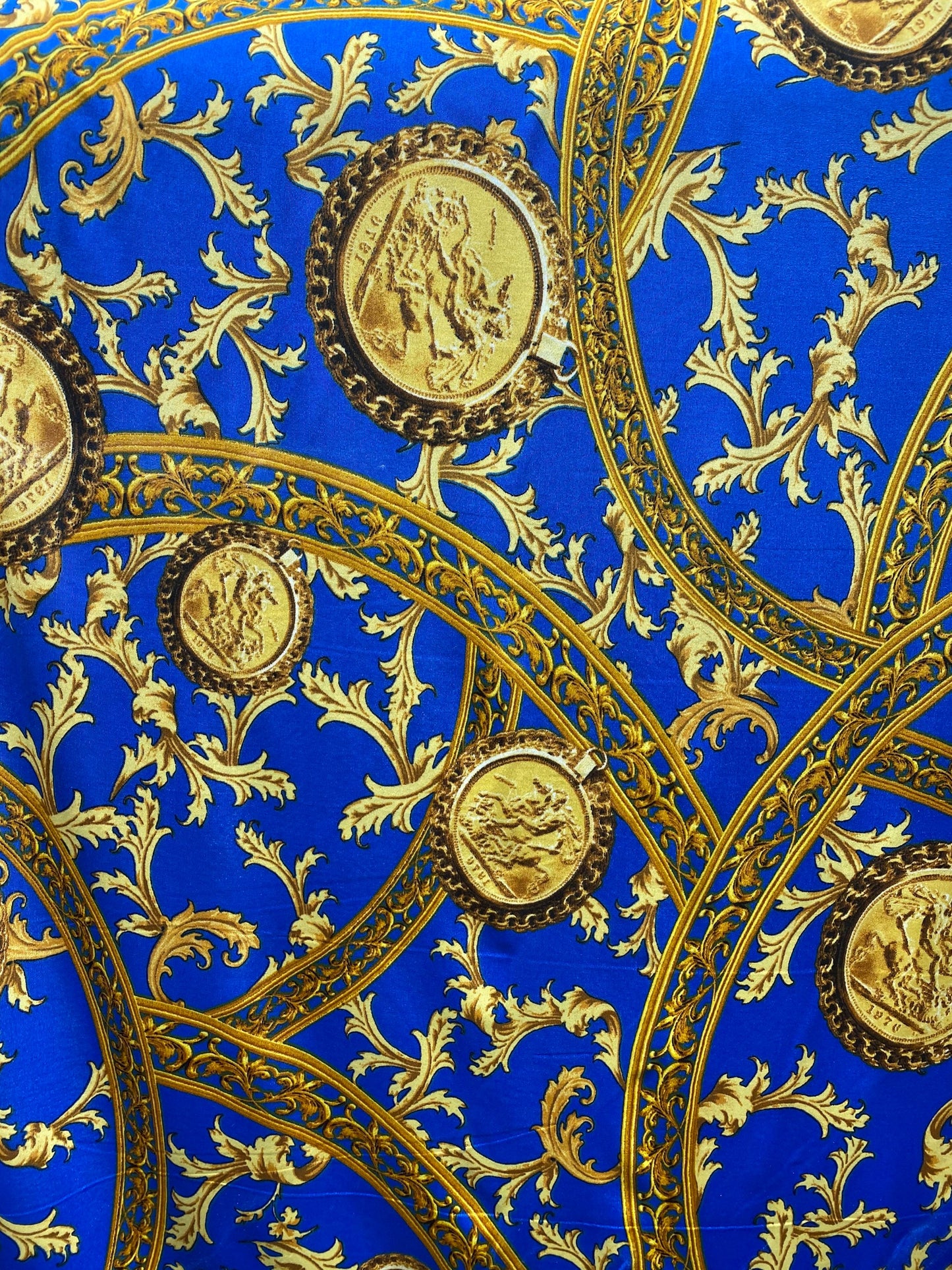 New modern print Sapphire/gold poly spandex medium weight 4-way stretch 58/60” Sold by the YD. Ships worldwide from Los Ángeles California.