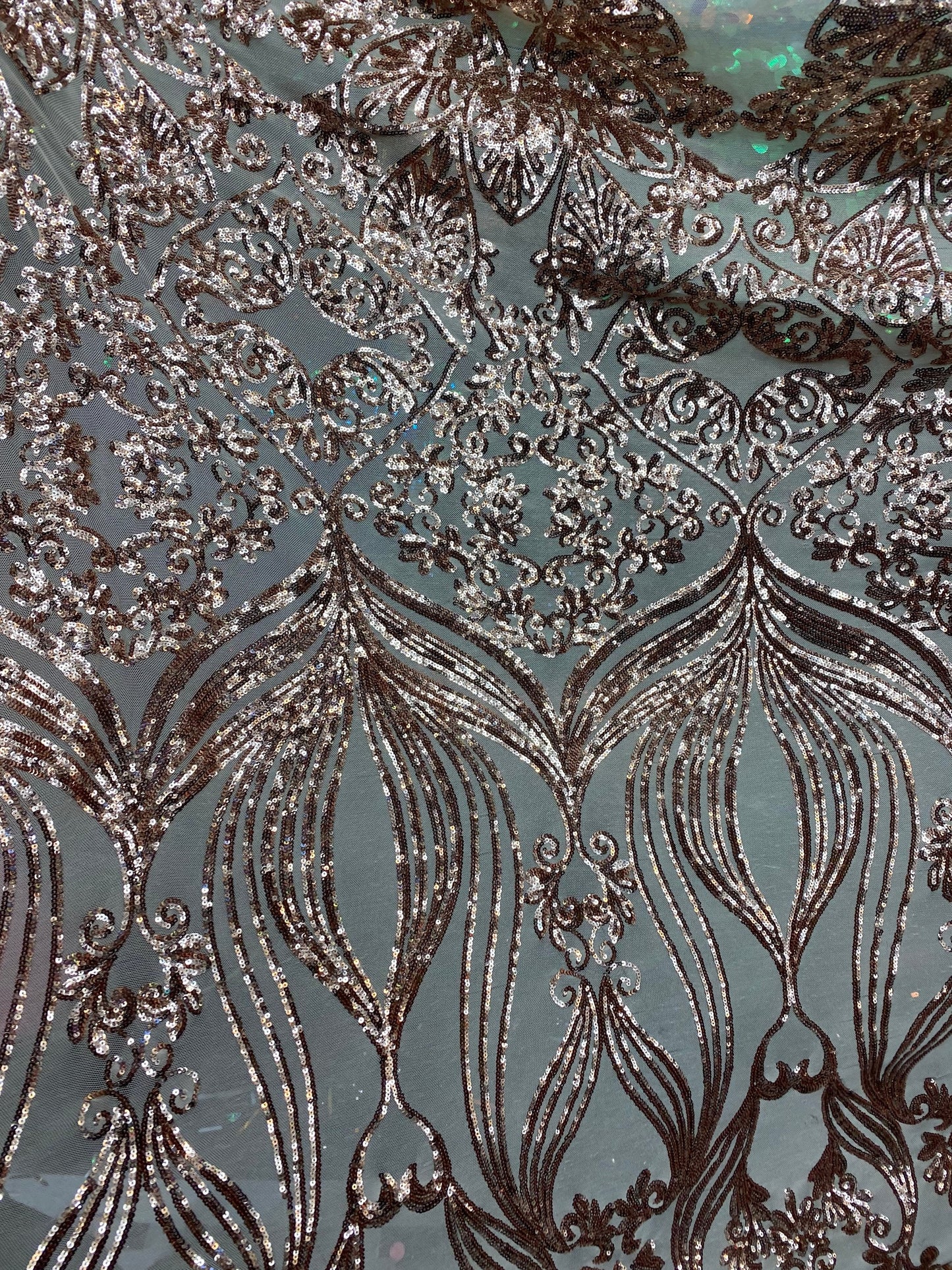 New modern sequins Jennifer design iridescent sequins on stretch mesh 2-way 58/60” Sold by the YD. Ships worldwide from Los Angeles CA USA.