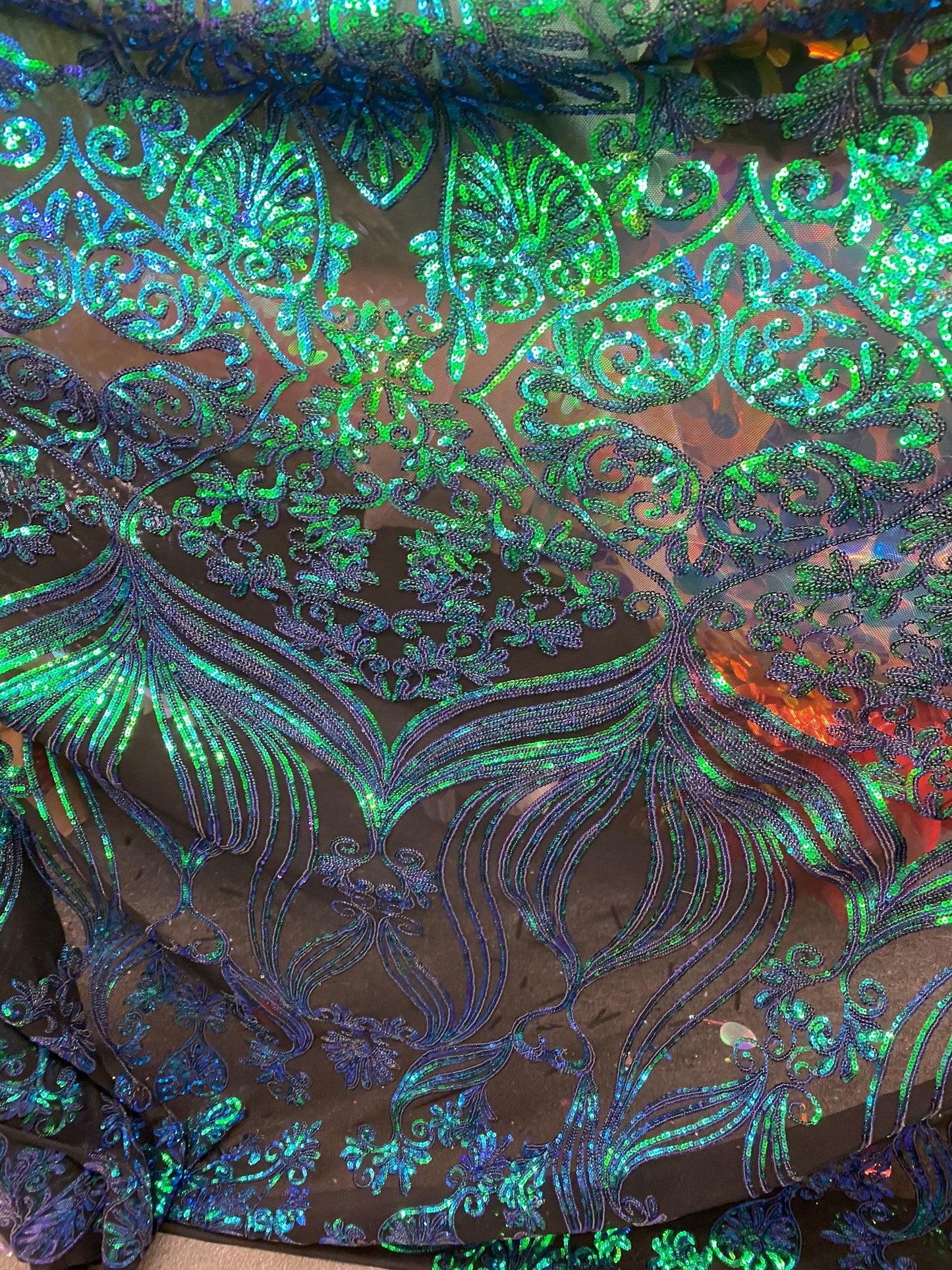 New modern sequins Jennifer design iridescent sequins on stretch mesh 2-way 58/60” Sold by the YD. Ships worldwide from Los Angeles CA USA.