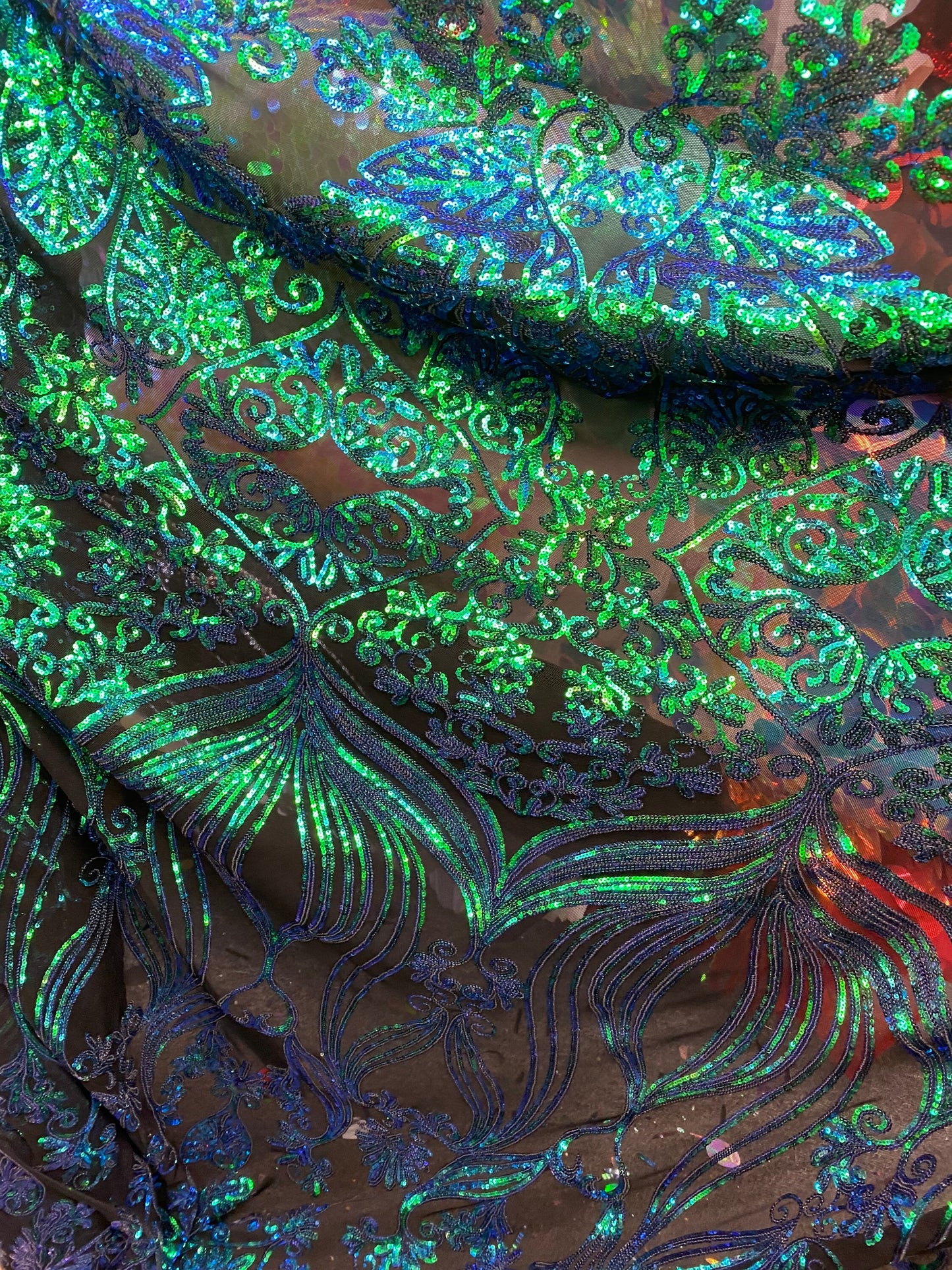 New modern sequins Jennifer design iridescent sequins on stretch mesh 2-way 58/60” Sold by the YD. Ships worldwide from Los Angeles CA USA.