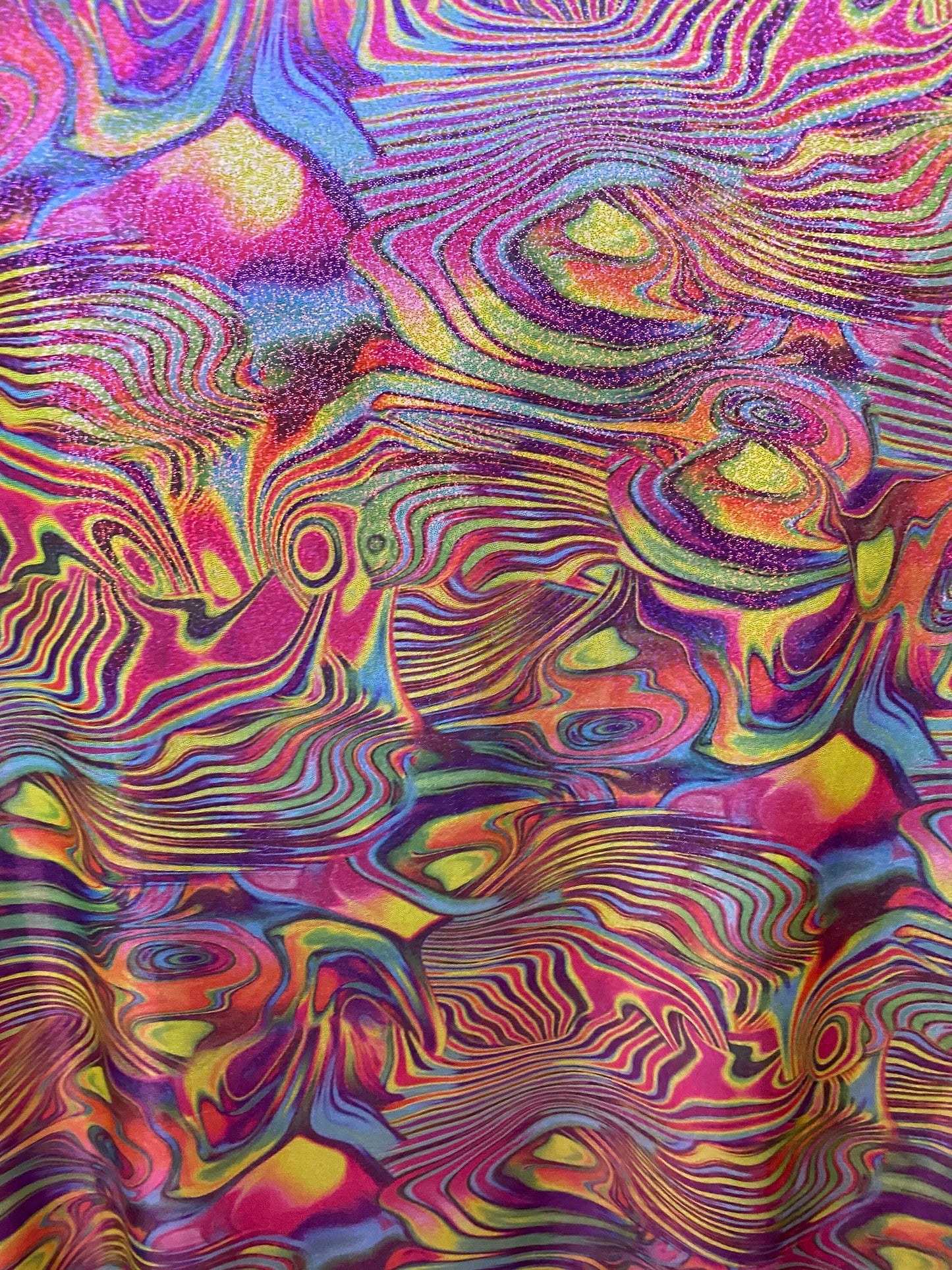 New lava design multicolor print on nylon spandex with foggy foil all over 4-way stretch 58/60” Sold by the YD. Ships worldwide from L.A CA.
