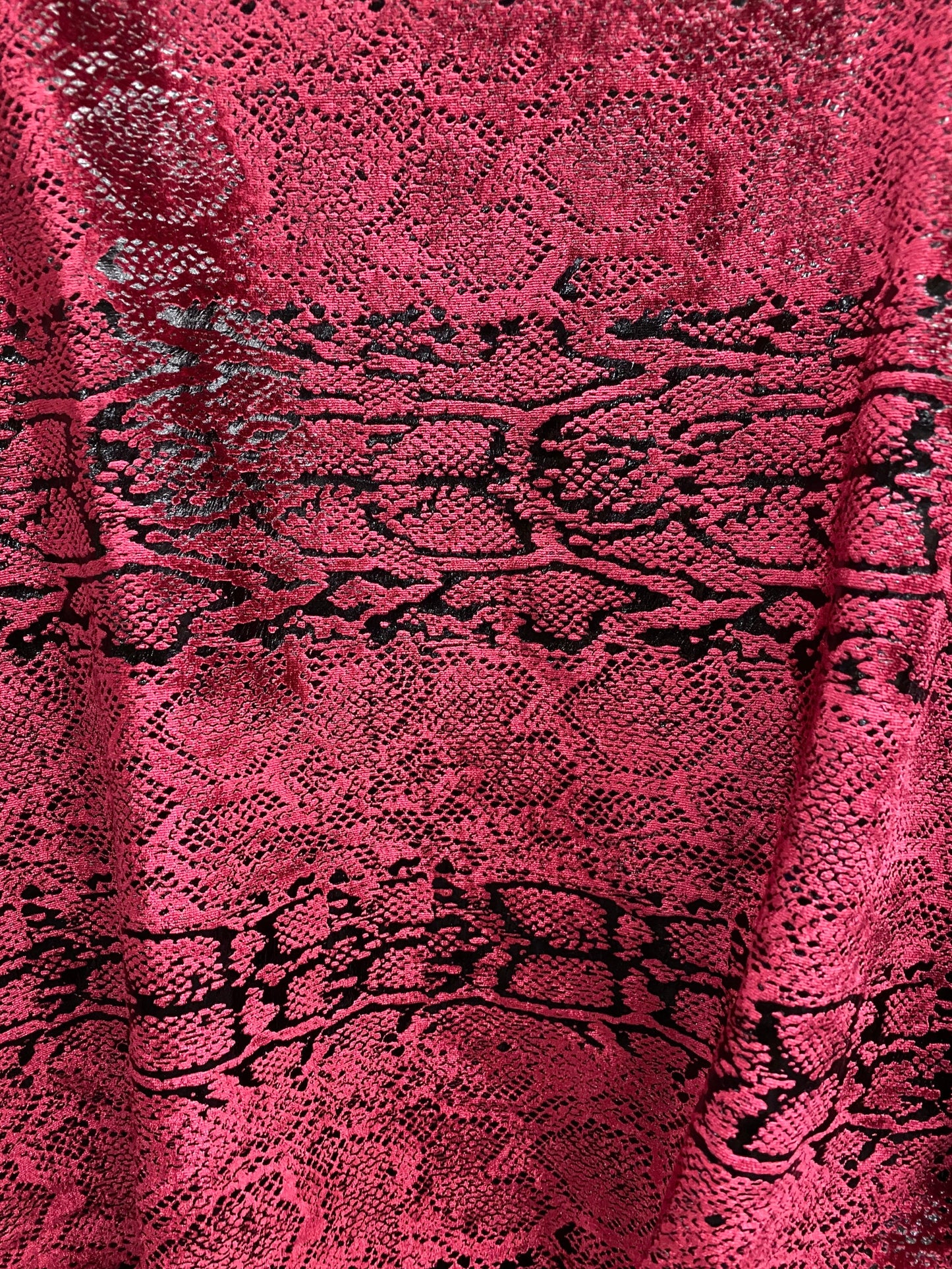 Metallic Stretch velvet snake design burgundy/black 2-way stretch 58/60” Sold by the YD. Ships worldwide from Los Angeles California USA.