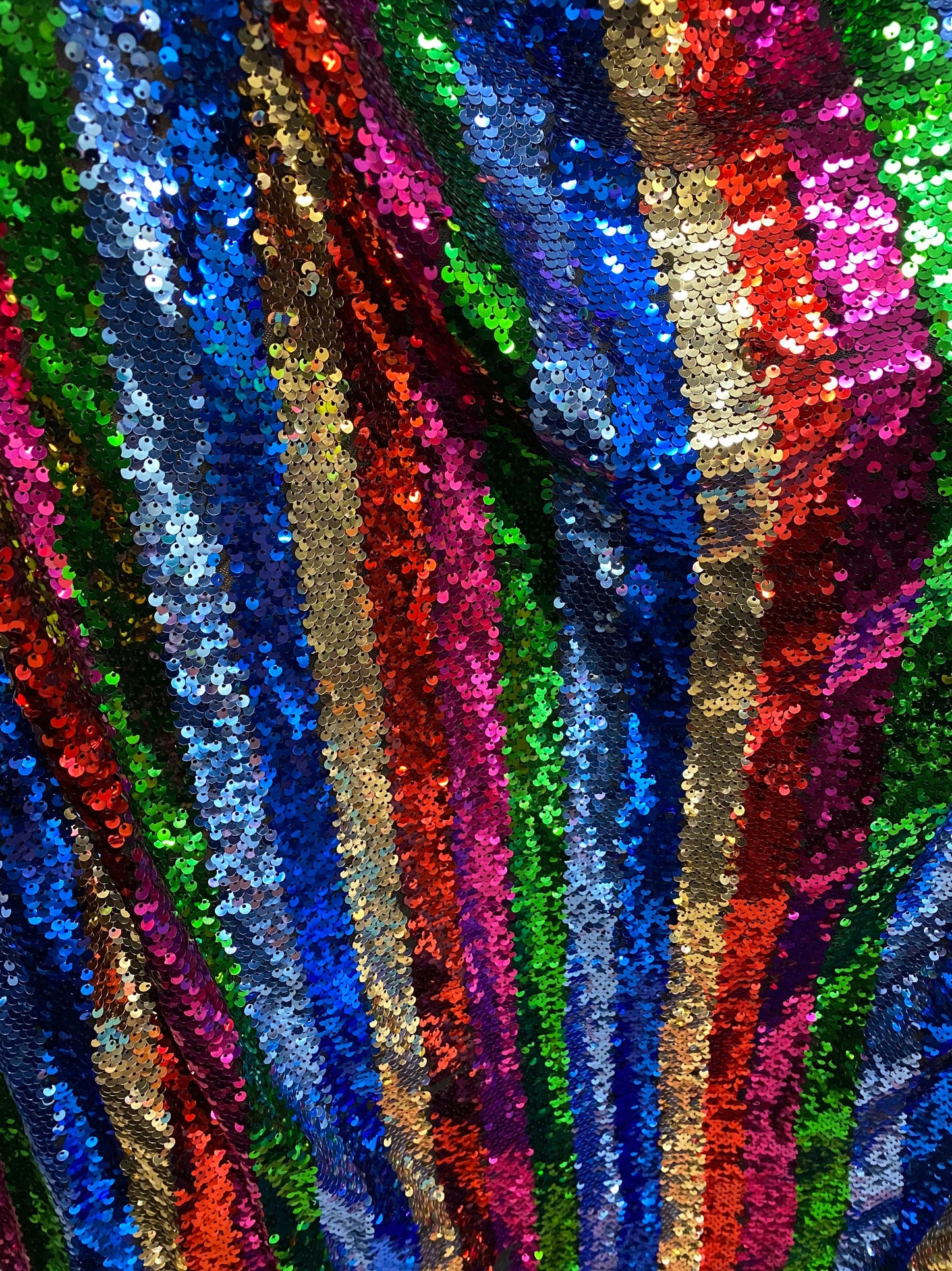 New stripe design rainbow sequins multicolor on stretch mesh 2-way 55/57” Sold by the YD. Ships worldwide from Los Angeles California USA.