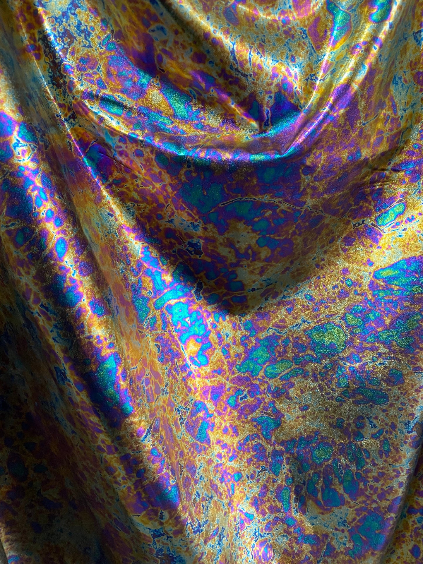 New Modern Lava design oil effect metallic nylon spandex all over foil 4-way 58/60” Sold by the YD. Ships worldwide from Los Angeles CA USA.