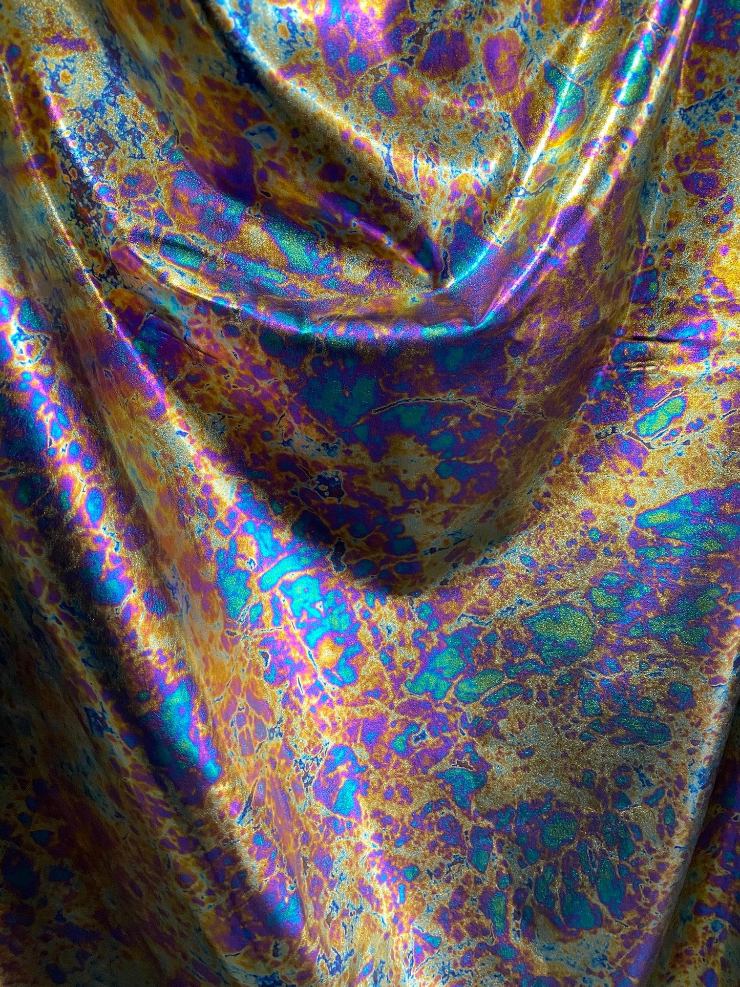 New Modern Lava design oil effect metallic nylon spandex all over foil 4-way 58/60” Sold by the YD. Ships worldwide from Los Angeles CA USA.