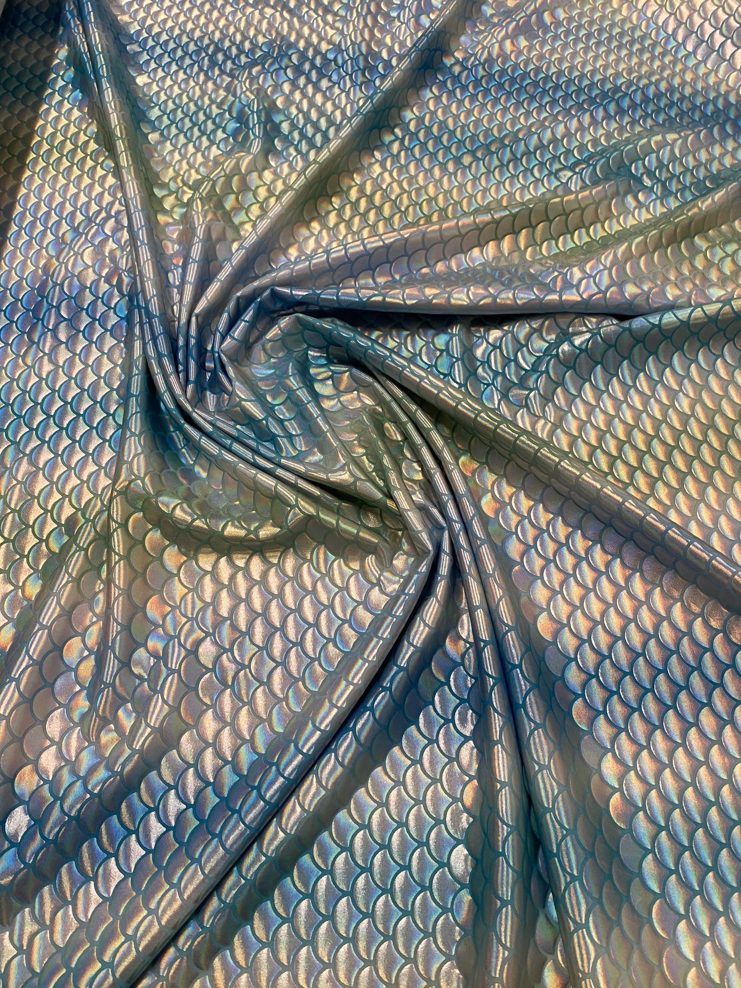 New Rainbow mermaid design blue/silver iridescent metallic nylon spandex 4-way stretch 58/60” Sold by the YD. Ships worldwide from L.A CA.