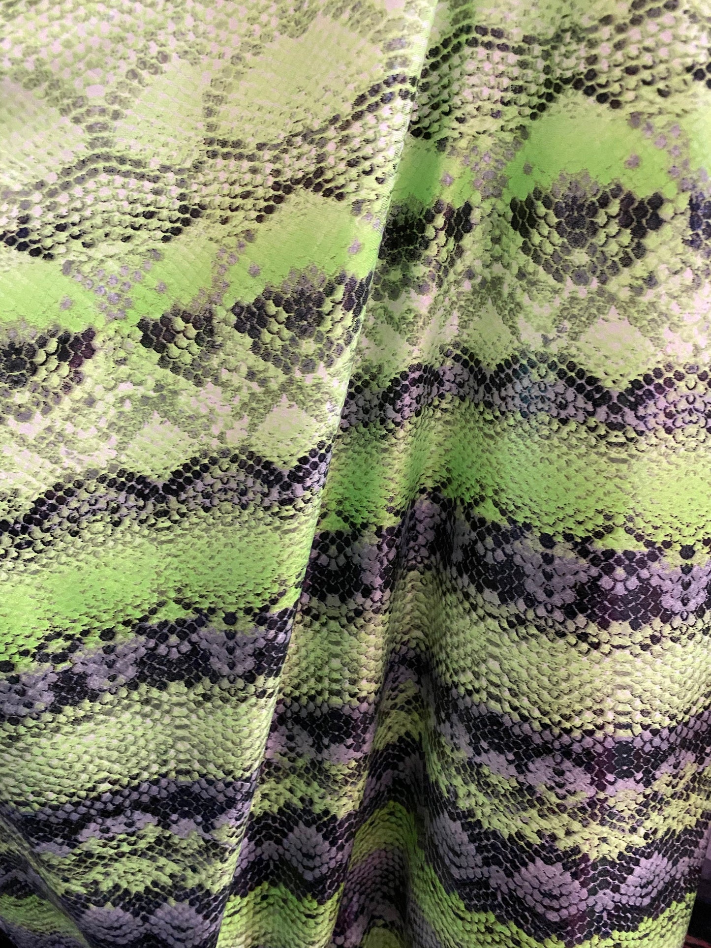New neon green snake print on poly 4 way stretch spandex fabric 58/60” inch sold by the yard. Ships worldwide from Los Angeles California