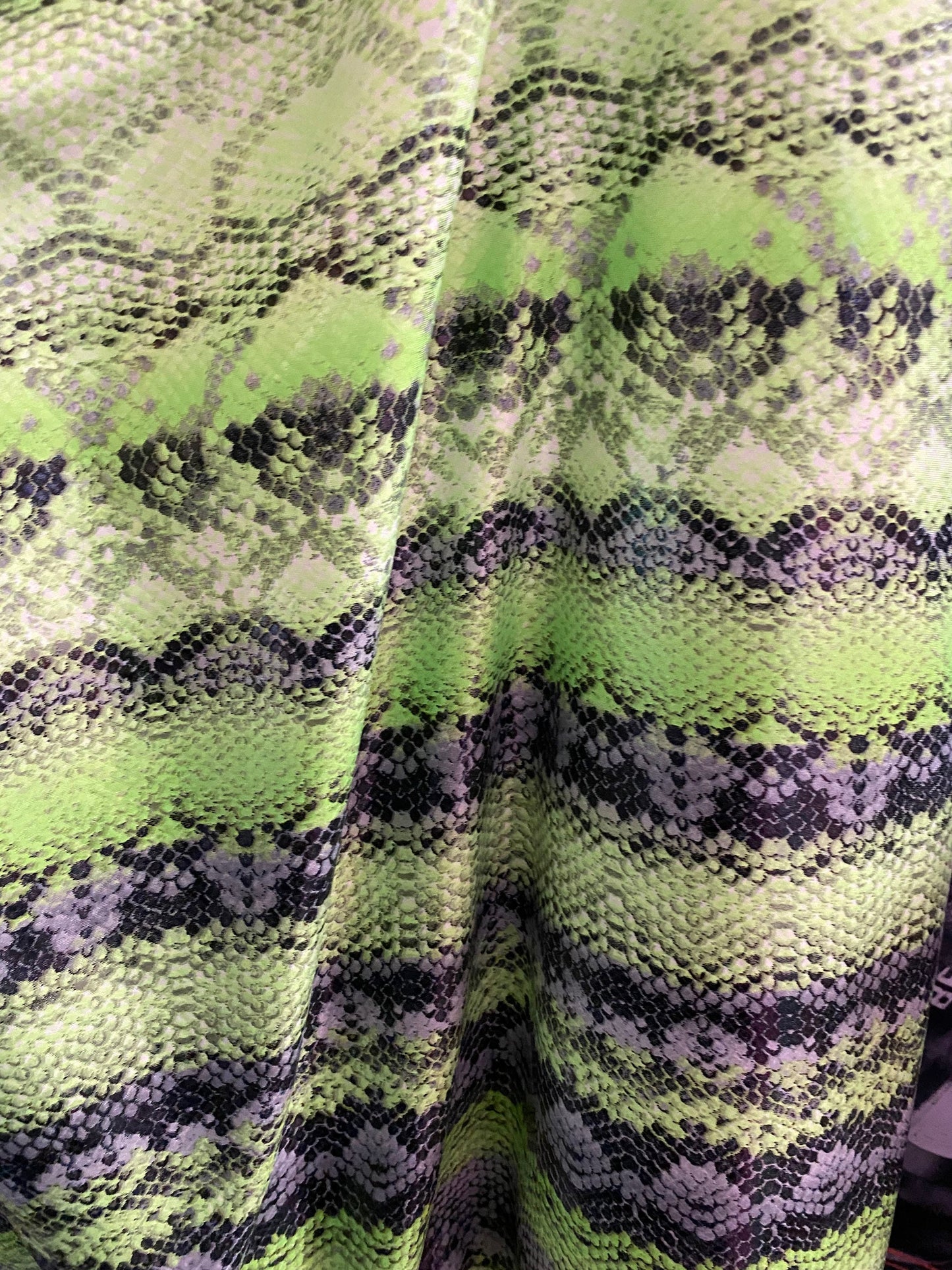 New neon green snake print on poly 4 way stretch spandex fabric 58/60” inch sold by the yard. Ships worldwide from Los Angeles California