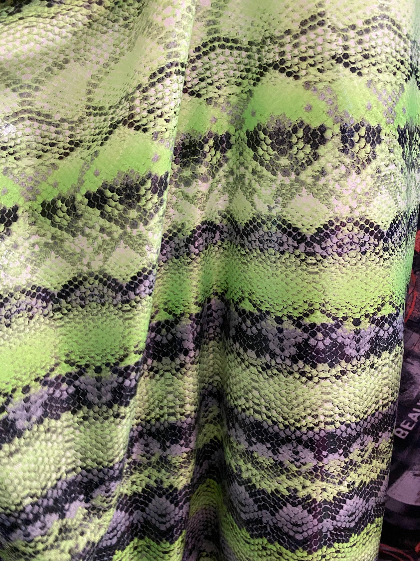 New neon green snake print on poly 4 way stretch spandex fabric 58/60” inch sold by the yard. Ships worldwide from Los Angeles California