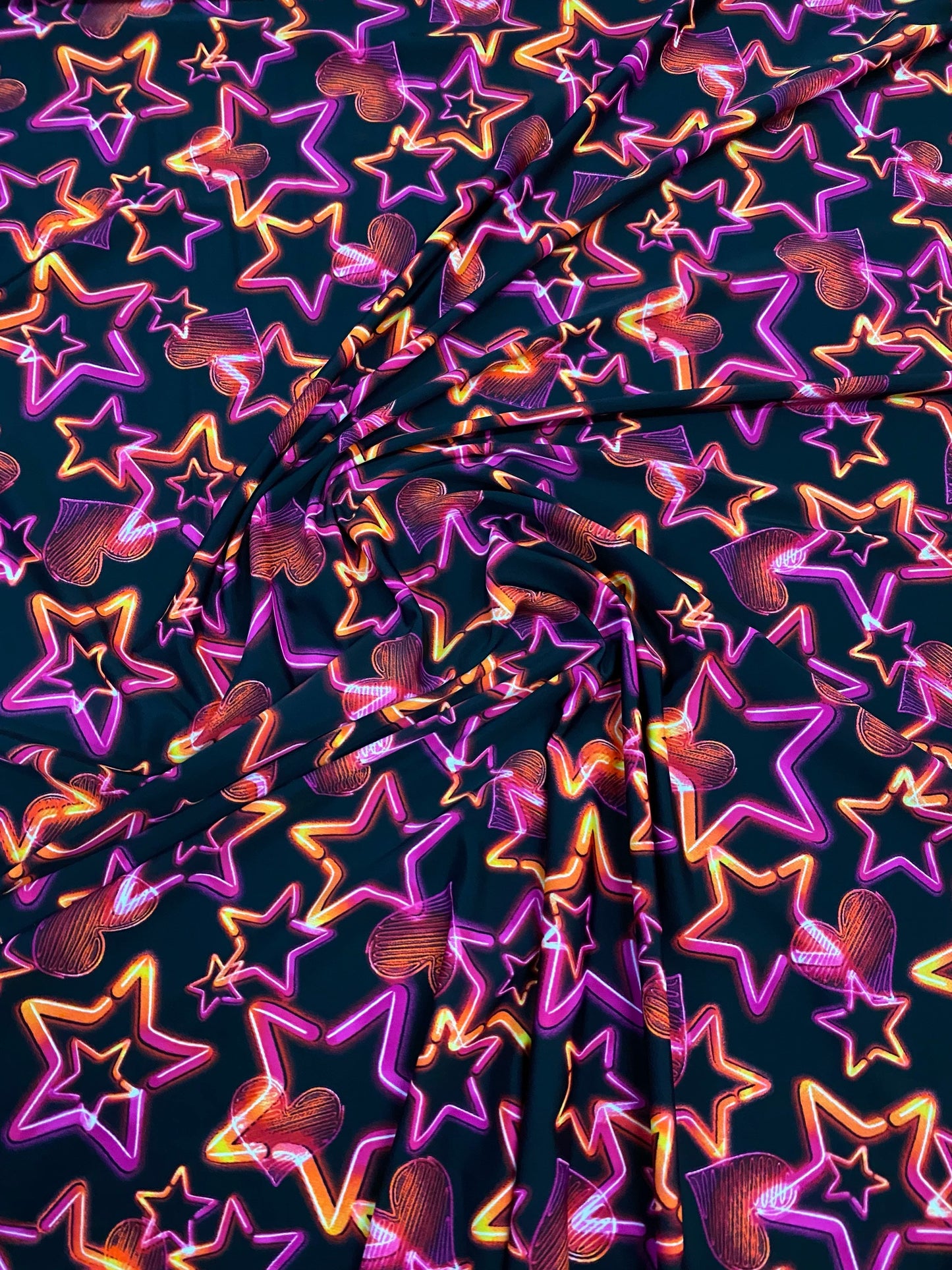 New 3D stars design black multicolor print on nylon spandex 4-way Stretch 58/60” Sold by the YD. Ships worldwide from Los Angeles California