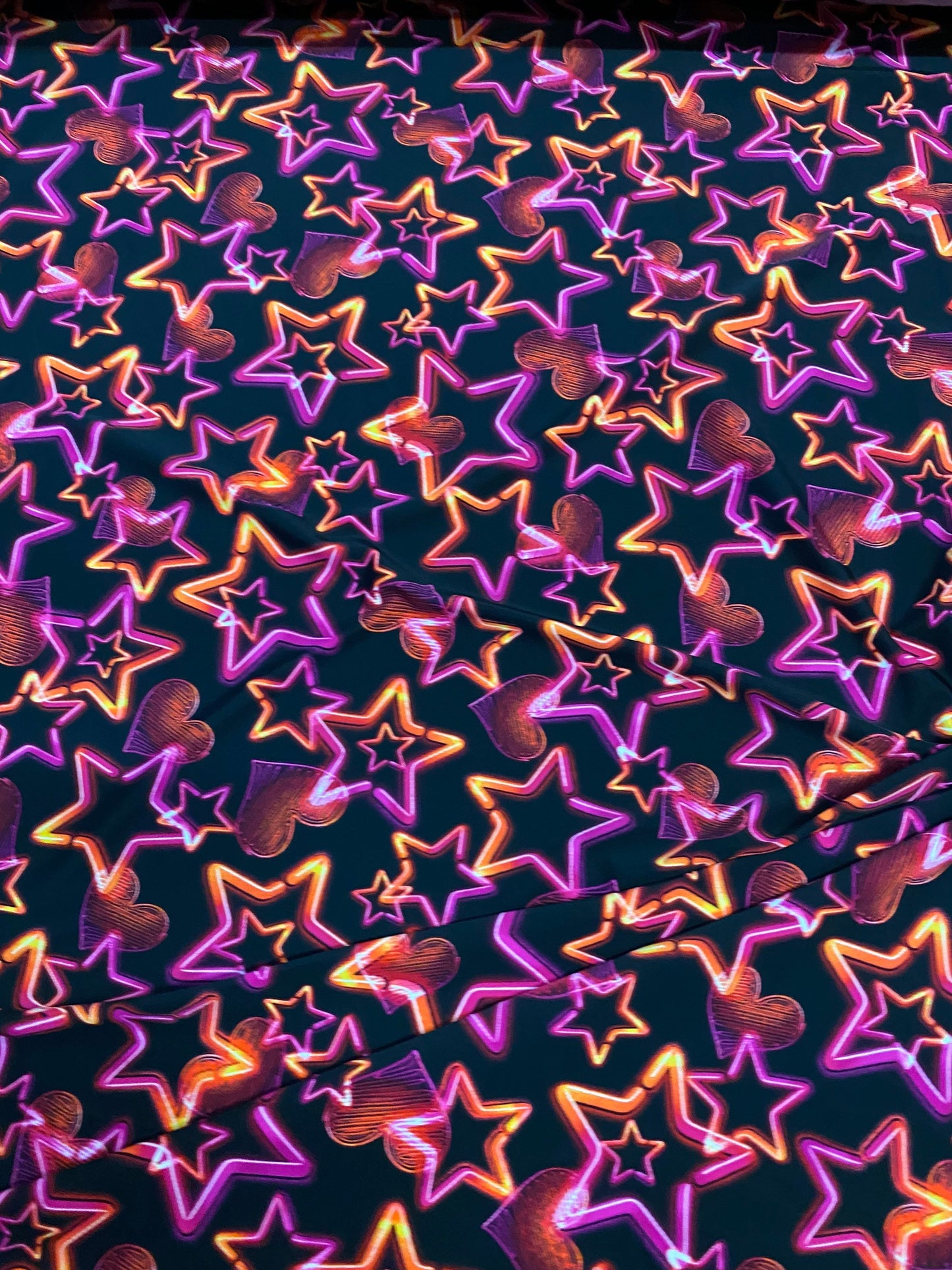 New 3D stars design black multicolor print on nylon spandex 4-way Stretch 58/60” Sold by the YD. Ships worldwide from Los Angeles California