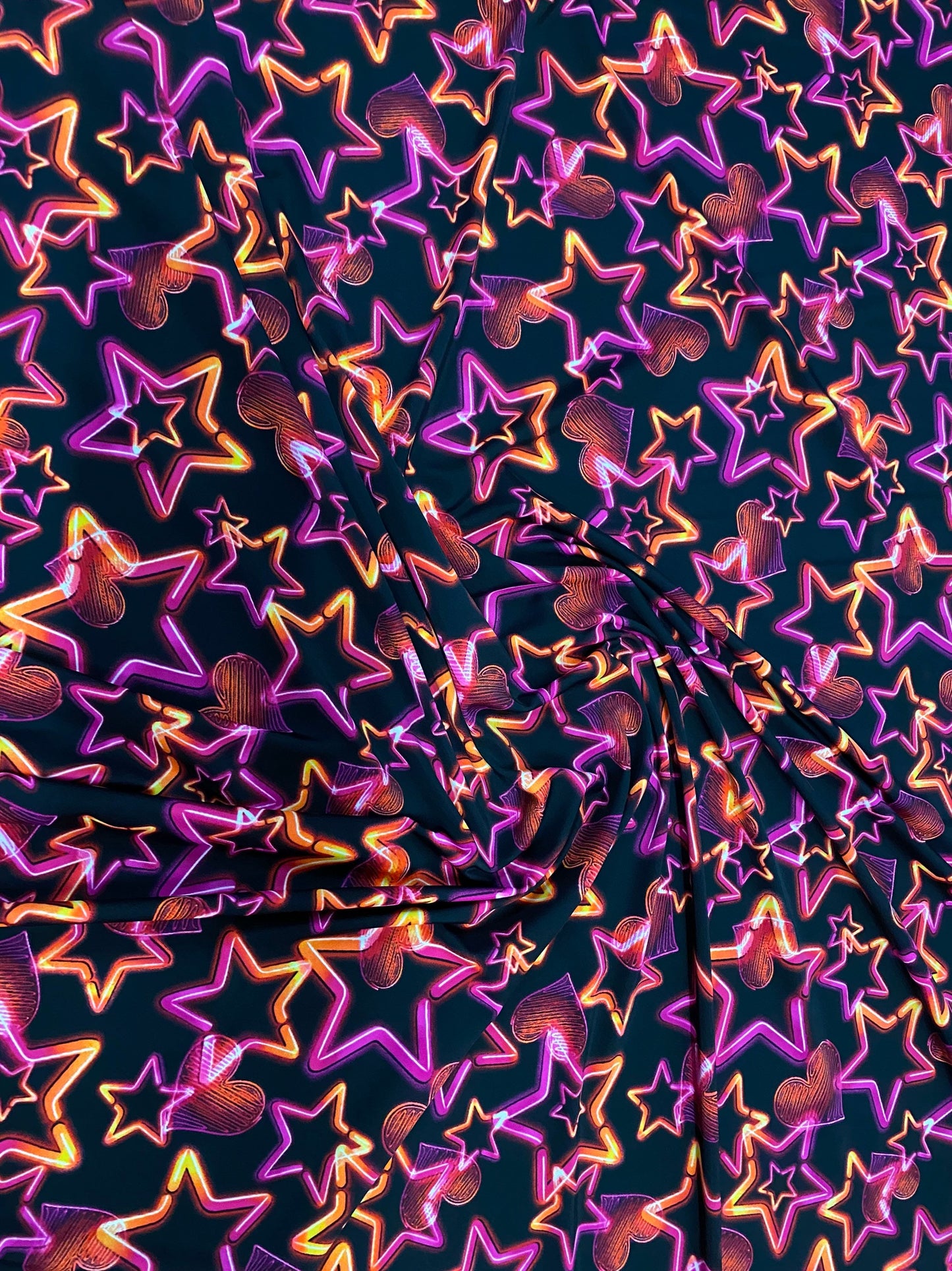 New 3D stars design black multicolor print on nylon spandex 4-way Stretch 58/60” Sold by the YD. Ships worldwide from Los Angeles California