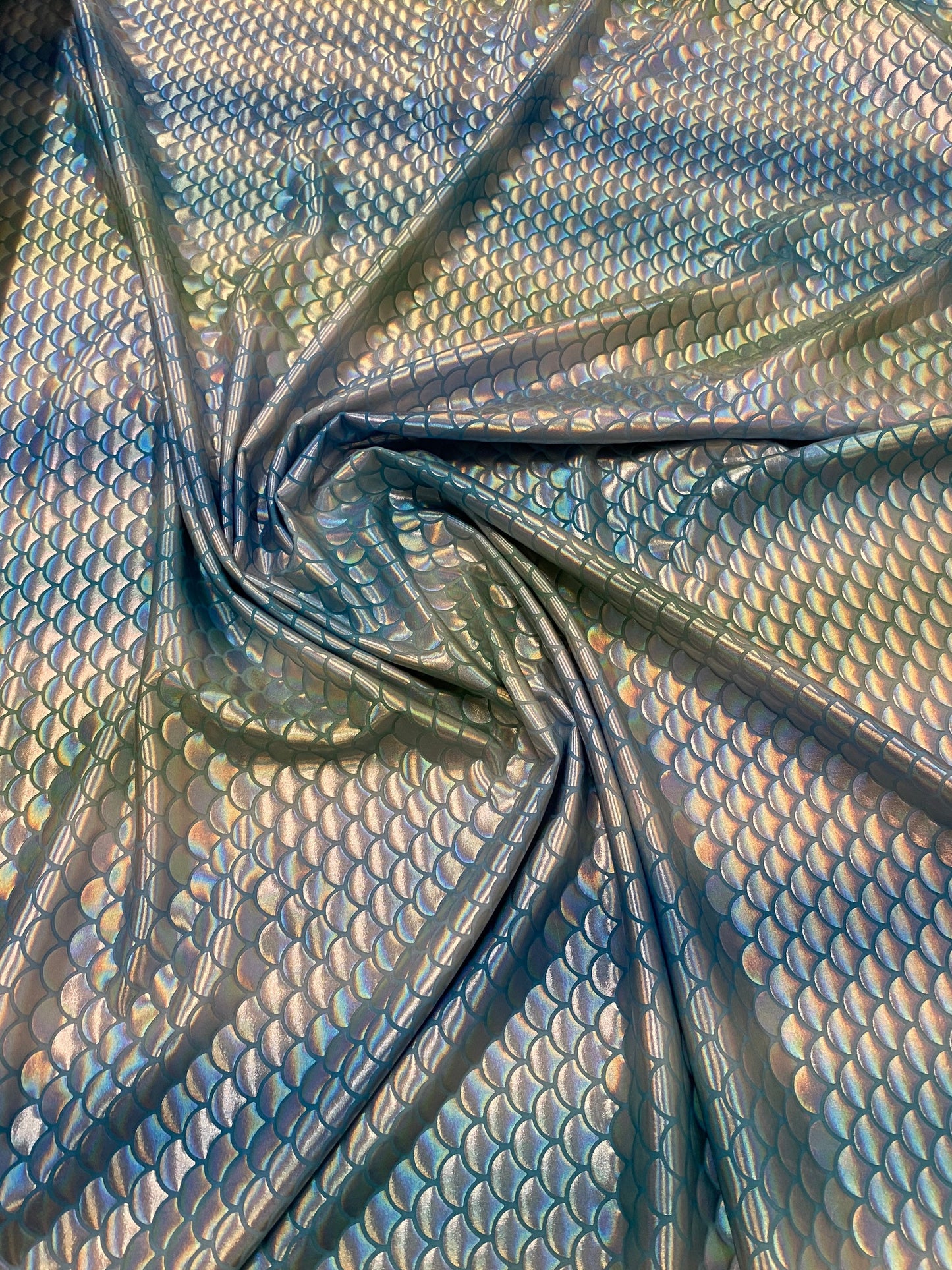 New Rainbow mermaid design blue/silver iridescent metallic nylon spandex 4-way stretch 58/60” Sold by the YD. Ships worldwide from L.A CA.