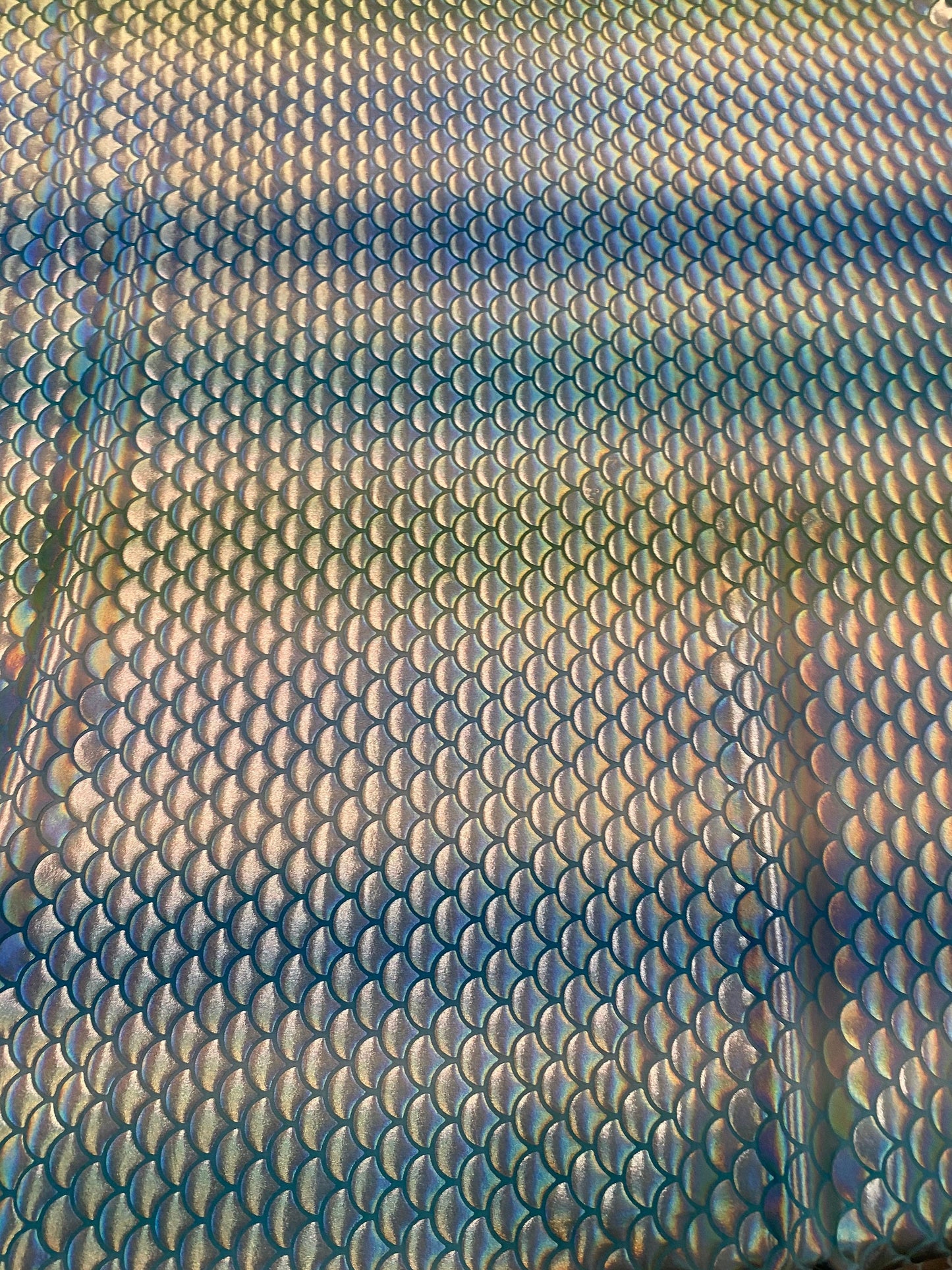 New Rainbow mermaid design blue/silver iridescent metallic nylon spandex 4-way stretch 58/60” Sold by the YD. Ships worldwide from L.A CA.
