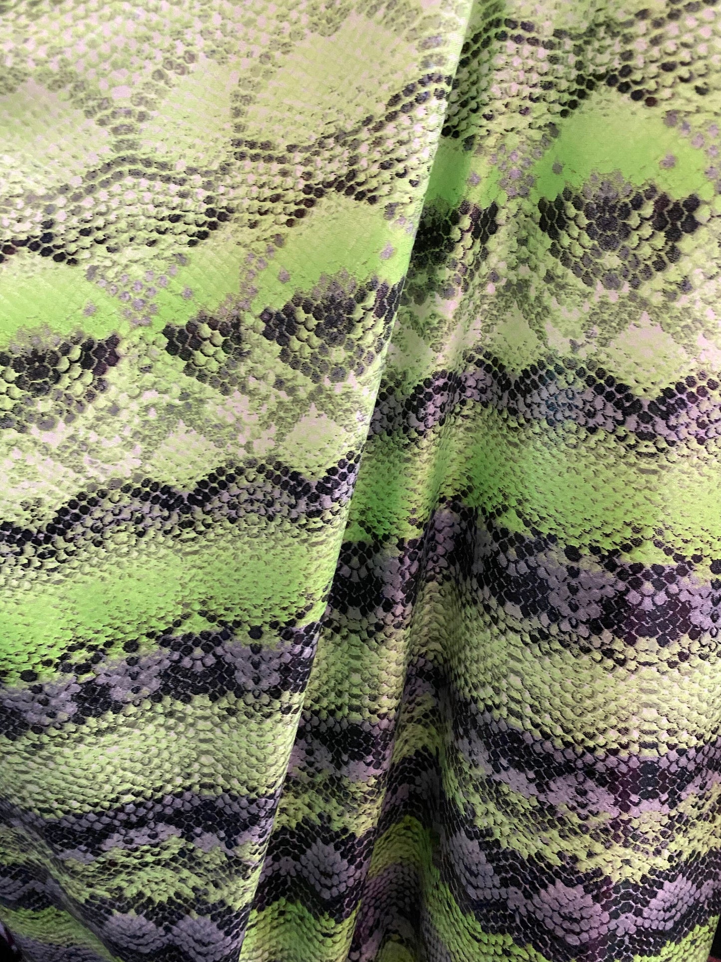 New neon green snake print on poly 4 way stretch spandex fabric 58/60” inch sold by the yard. Ships worldwide from Los Angeles California