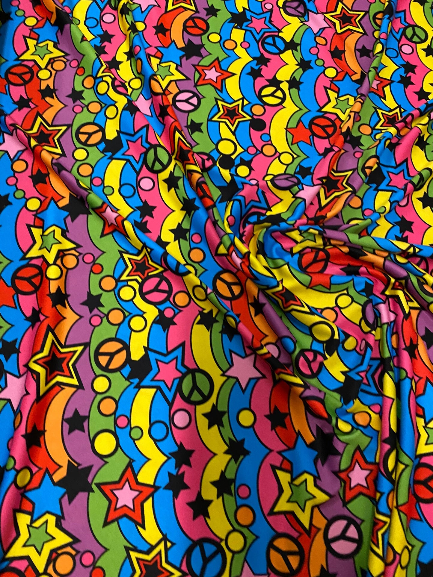 New poly spandex multi starts and circle design 4-way stretch 58/60” Sold by the YD. Ships worldwide from Los Angeles California USA.