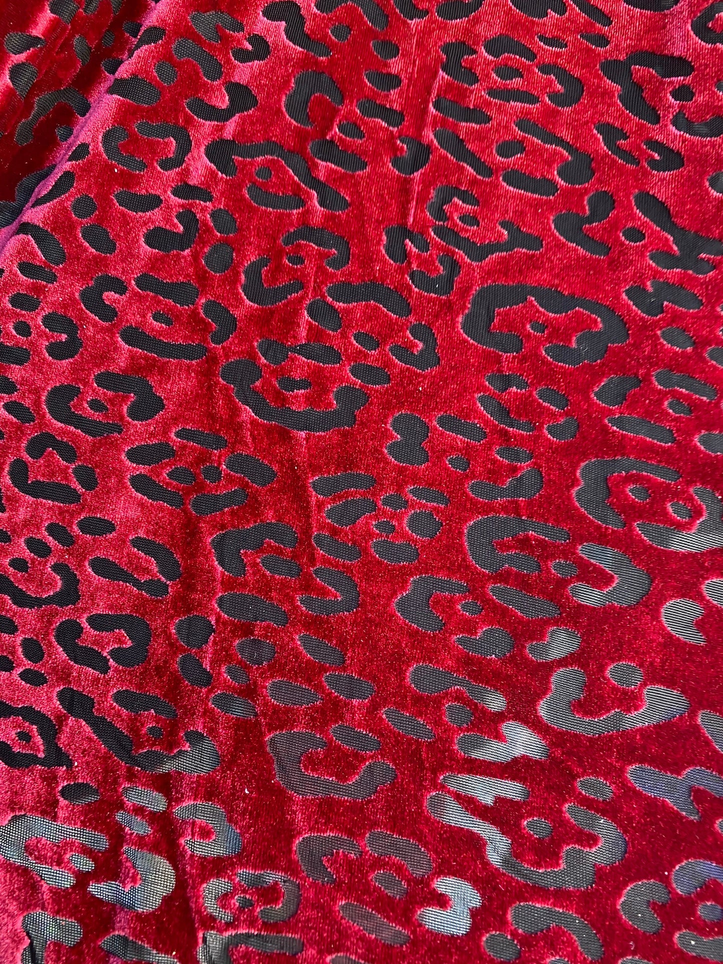 New burnout velvet leopard design black/DK red 4-way stretch 58/60” Sold by the YD. Ships worldwide from Los Angeles California USA.