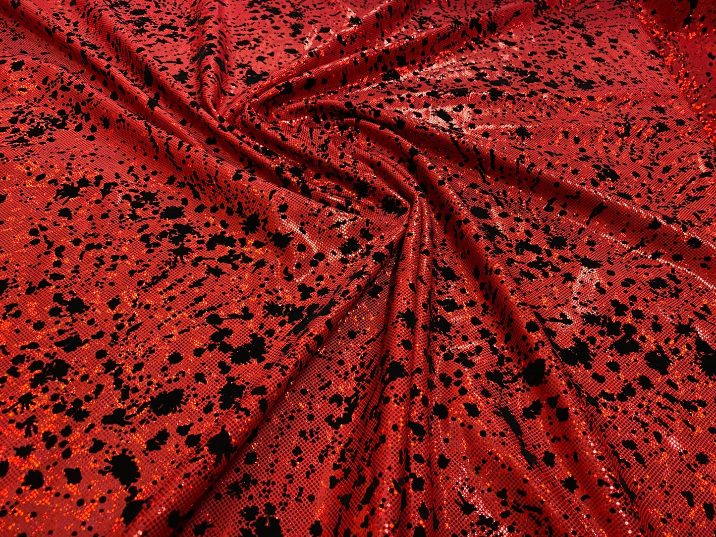 New splatter paint design hologram metallic nylon spandex with black flocking 4-way stretch 58/60” Sold by the YD. Ships worldwide from L.A