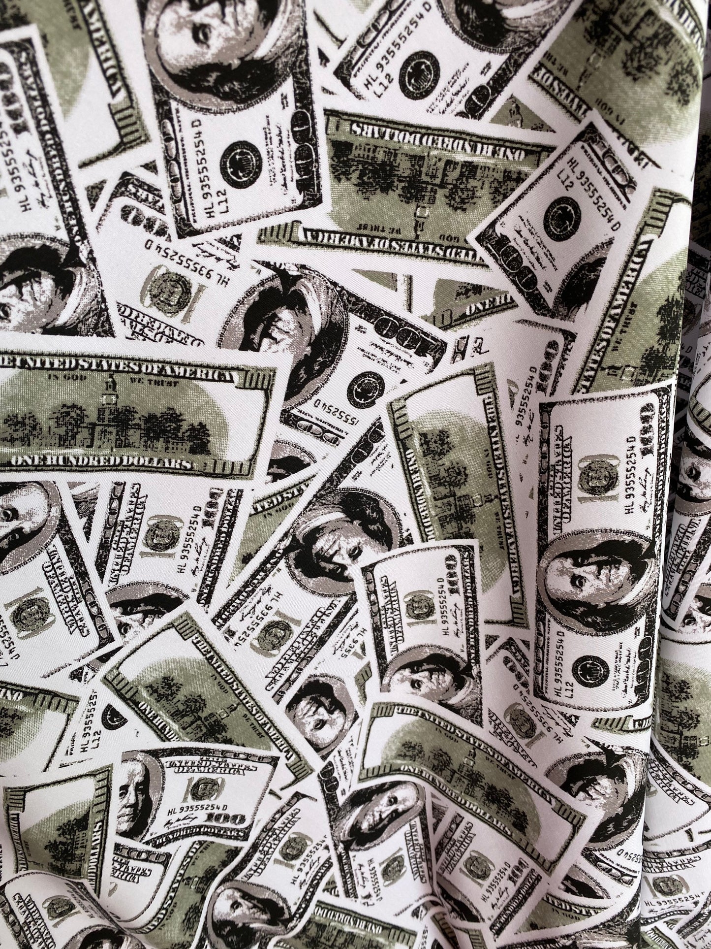 New money print design 100 dollars bill all over white/green print on nylon spandex 4-way stretch 58/60” Sold by the YD. Ships worldwide