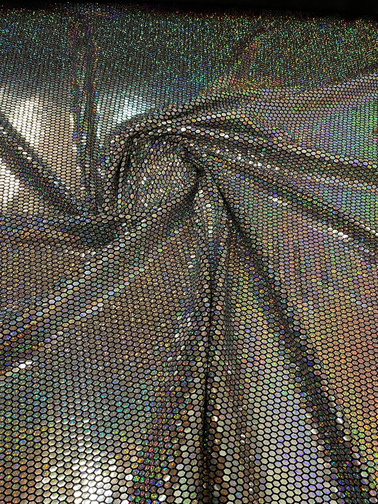 Honeycomb metallic sequins poly spandex 4way stretch 58/60” Sold by the YD. Ships worldwide from Los Angeles California USA.