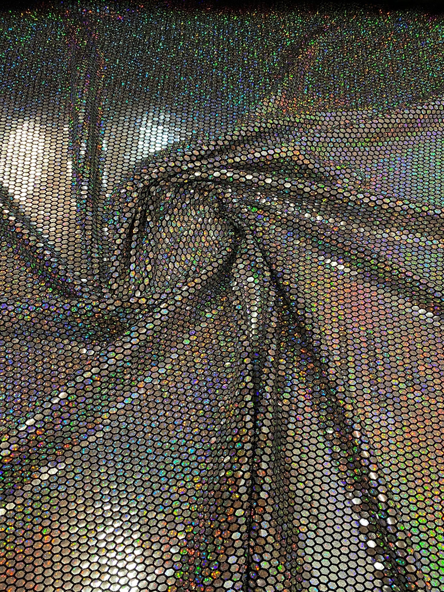 Honeycomb metallic sequins poly spandex 4way stretch 58/60” Sold by the YD. Ships worldwide from Los Angeles California USA.