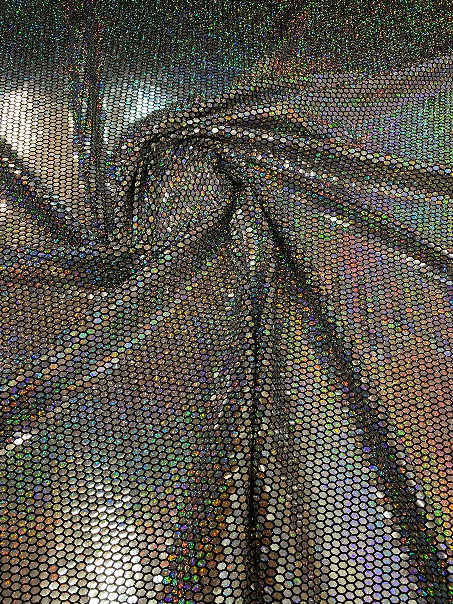 Honeycomb metallic sequins poly spandex 4way stretch 58/60” Sold by the YD. Ships worldwide from Los Angeles California USA.