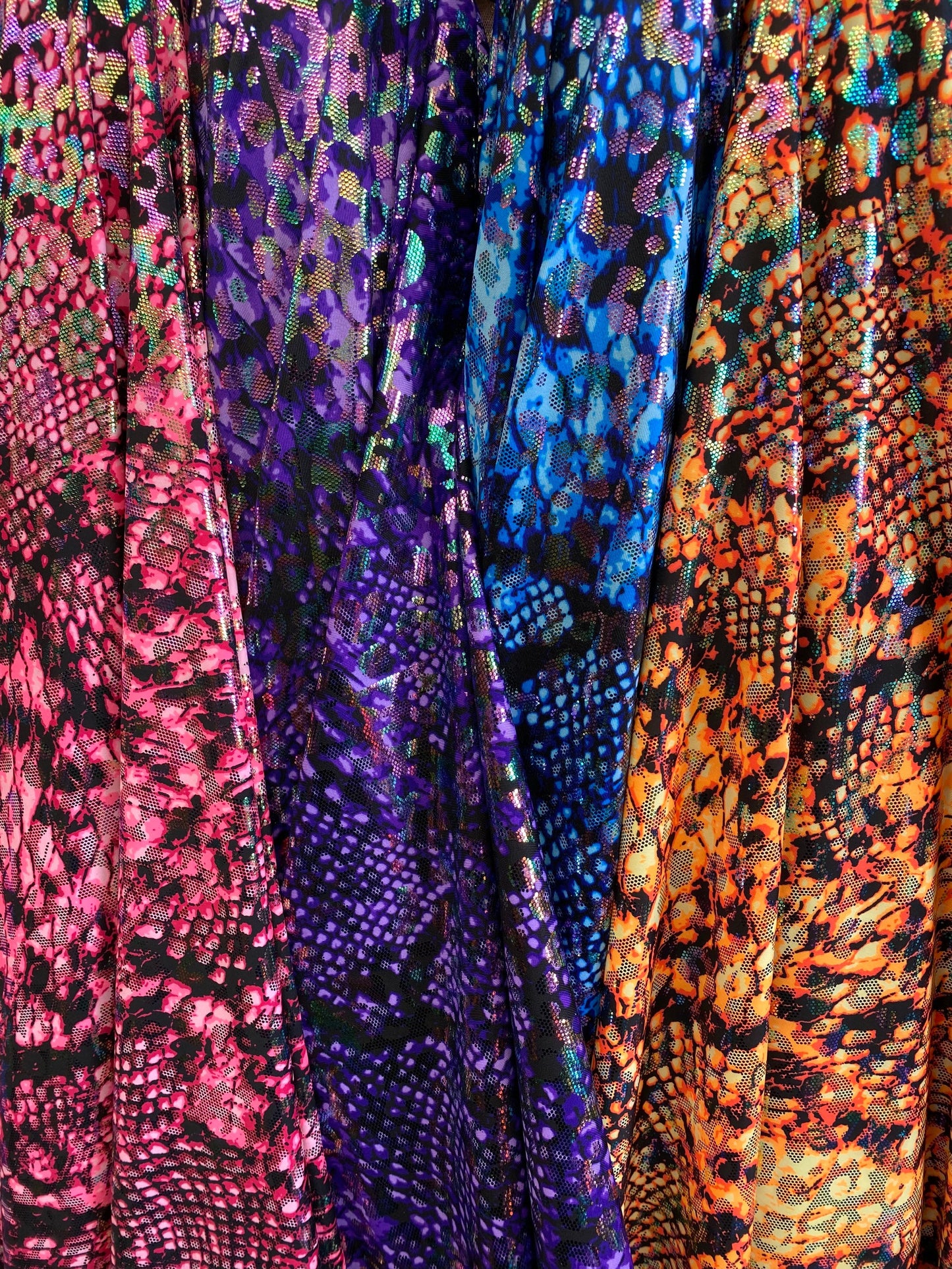 Iridescent metallic nylon spandex Cobra design 4way stretch 58/60” Sold by the YD. Ships worldwide from Los Angeles California USA