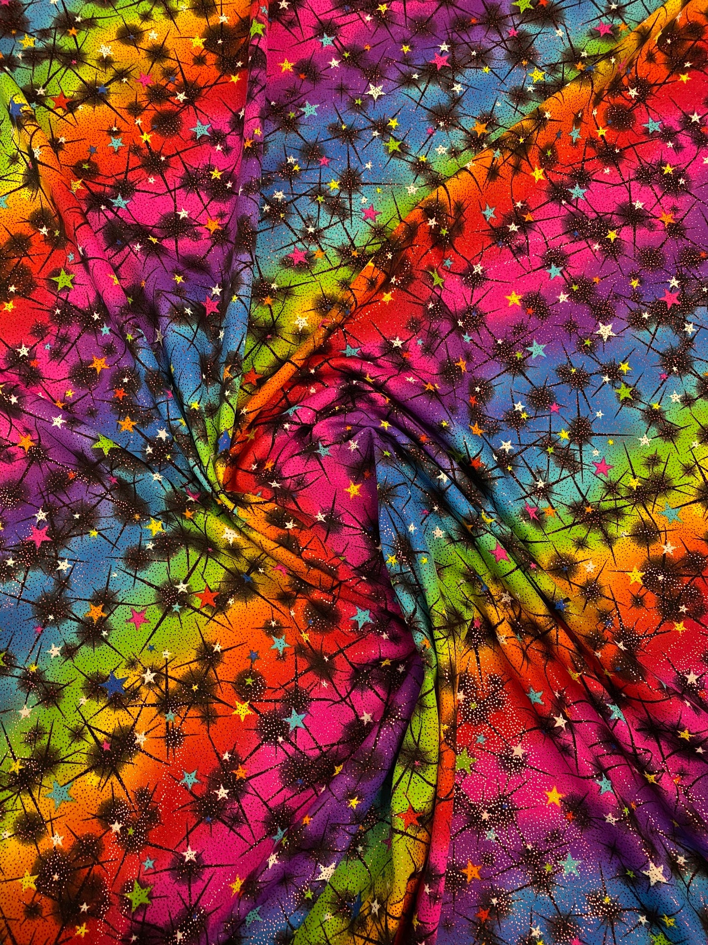 New rainbow Vegas design multi stars nylon spandex with foil 4-way stretch 58/60” Sold by the YD. Ships worldwide from Los Angeles CA USA.