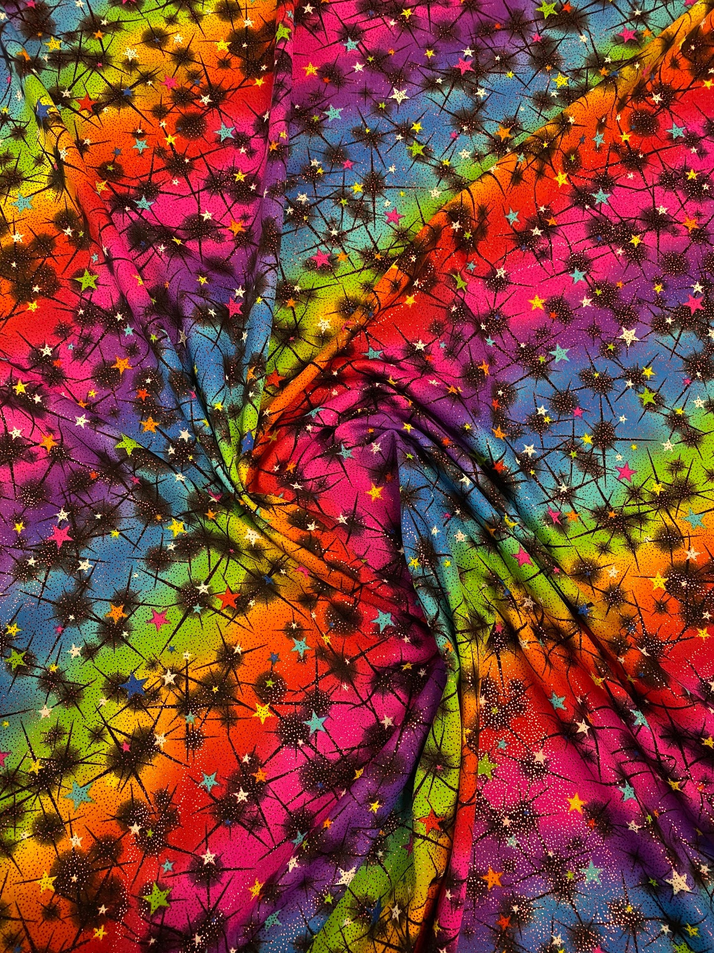 New rainbow Vegas design multi stars nylon spandex with foil 4-way stretch 58/60” Sold by the YD. Ships worldwide from Los Angeles CA USA.