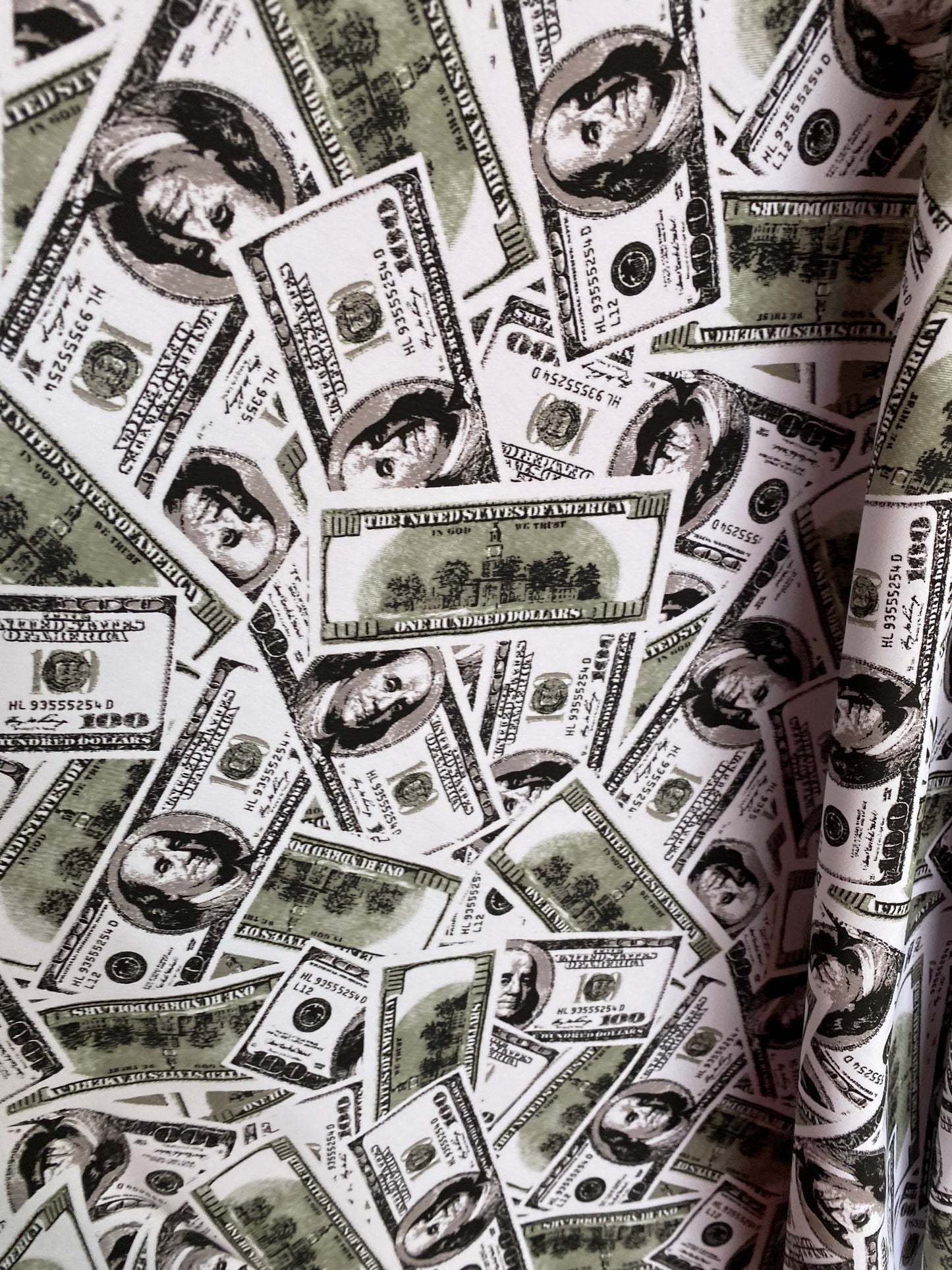 New money print design 100 dollars bill all over white/green print on nylon spandex 4-way stretch 58/60” Sold by the YD. Ships worldwide