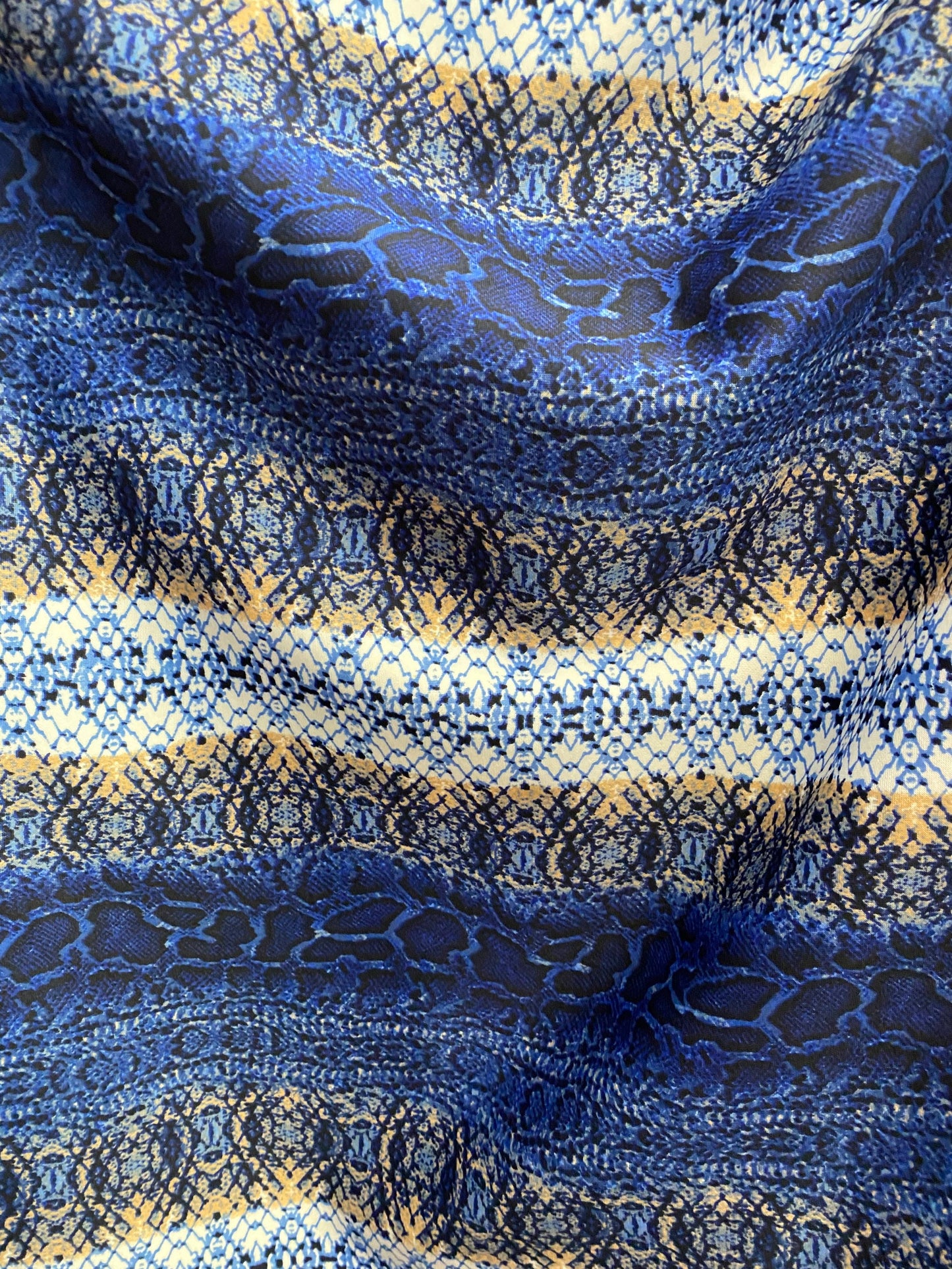 New Exotic snake design Sapphire/gold/beige print on poly techno spandex 2-way stretch 58/60” Sold by the YD. Ships worldwide from L.A CA