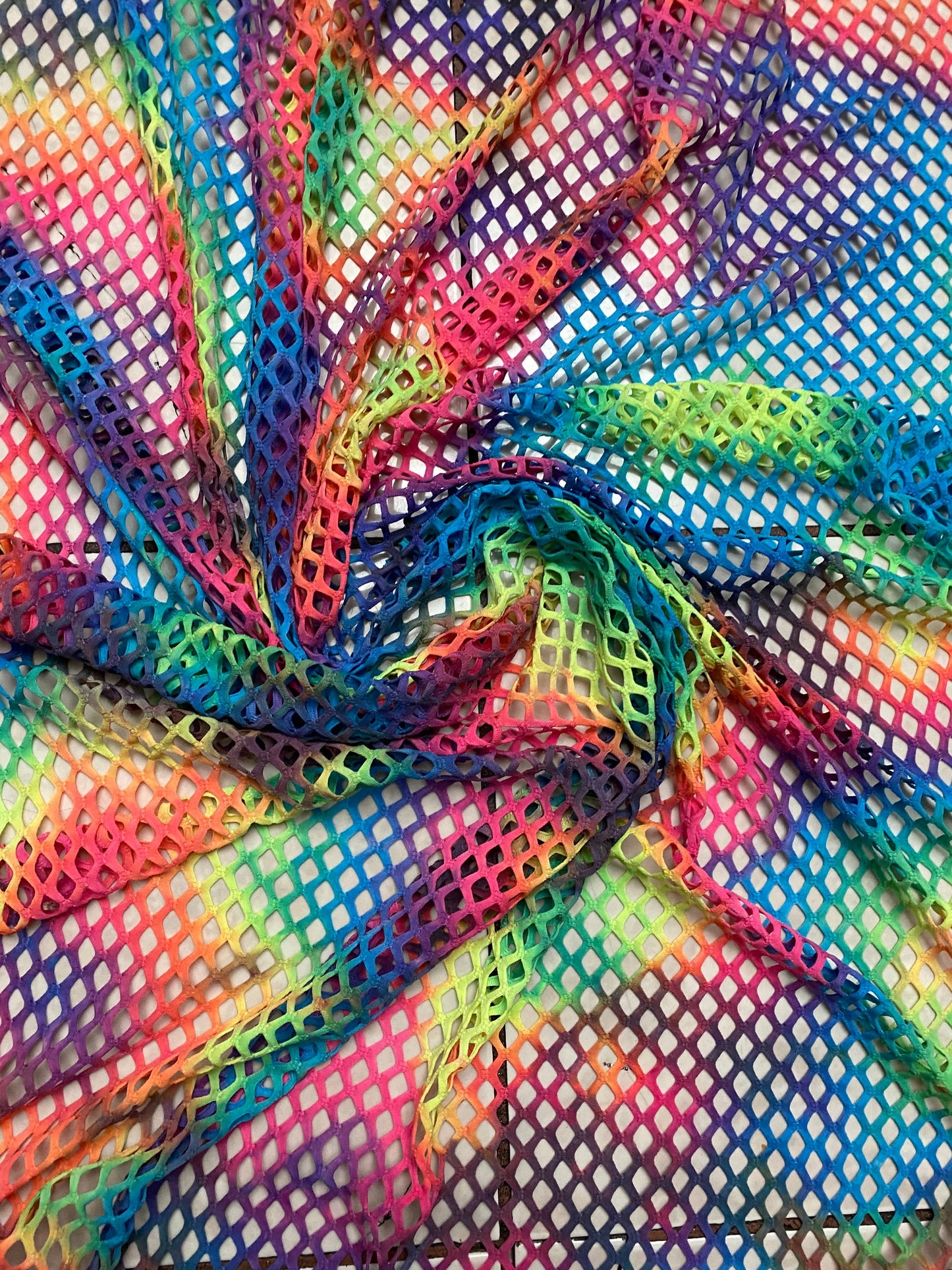 Pastel rainbow fishnet Tie dye Diamond mesh design 4-way stretch mesh 58/60” Sold by the YD. Ships worldwide from Los Angeles
