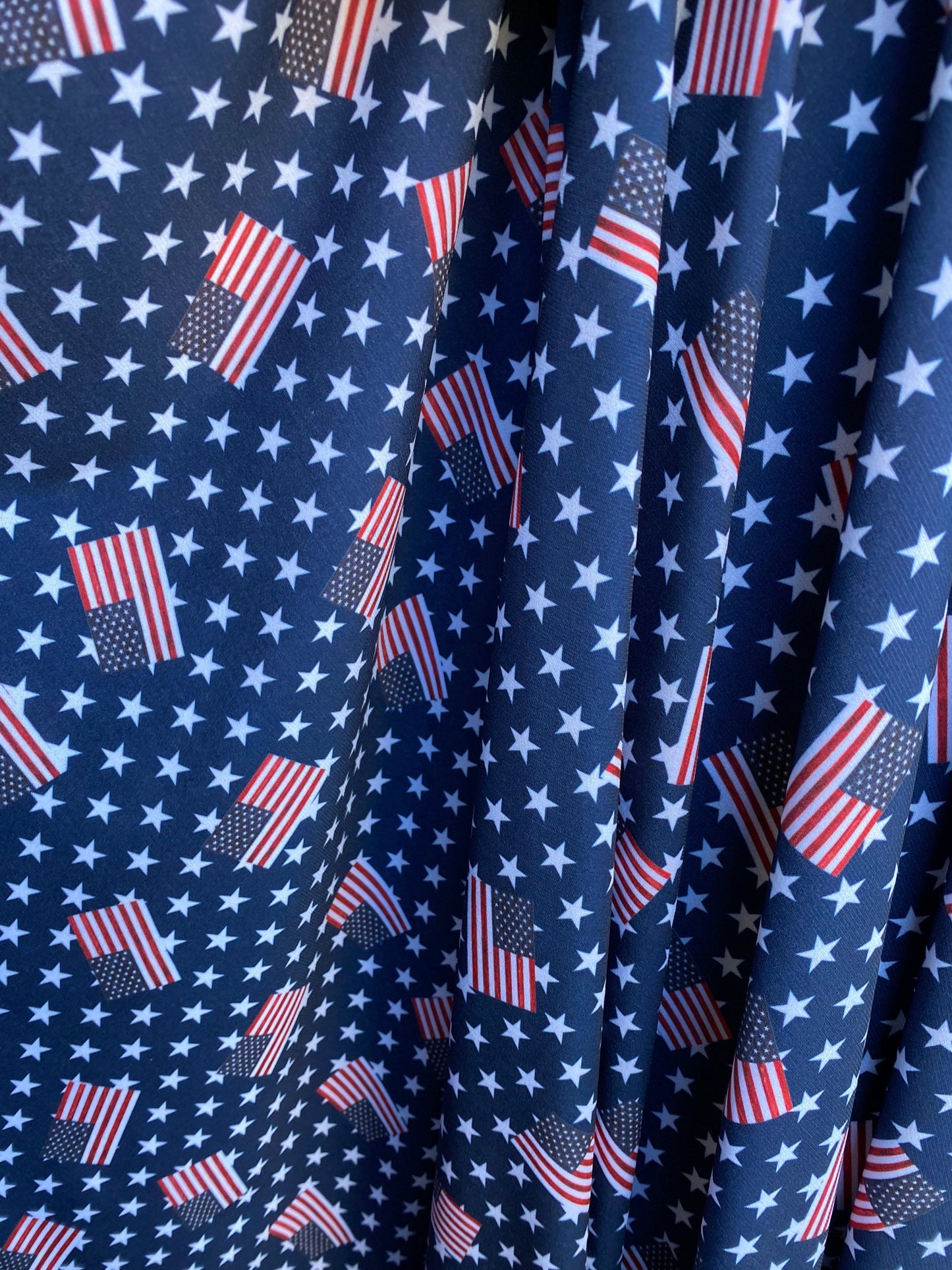 American flag design with freedom stars print on poly spandex light weight 4-way stretch 58/60” Sold by the YD. Ships worldwide from L.A CA