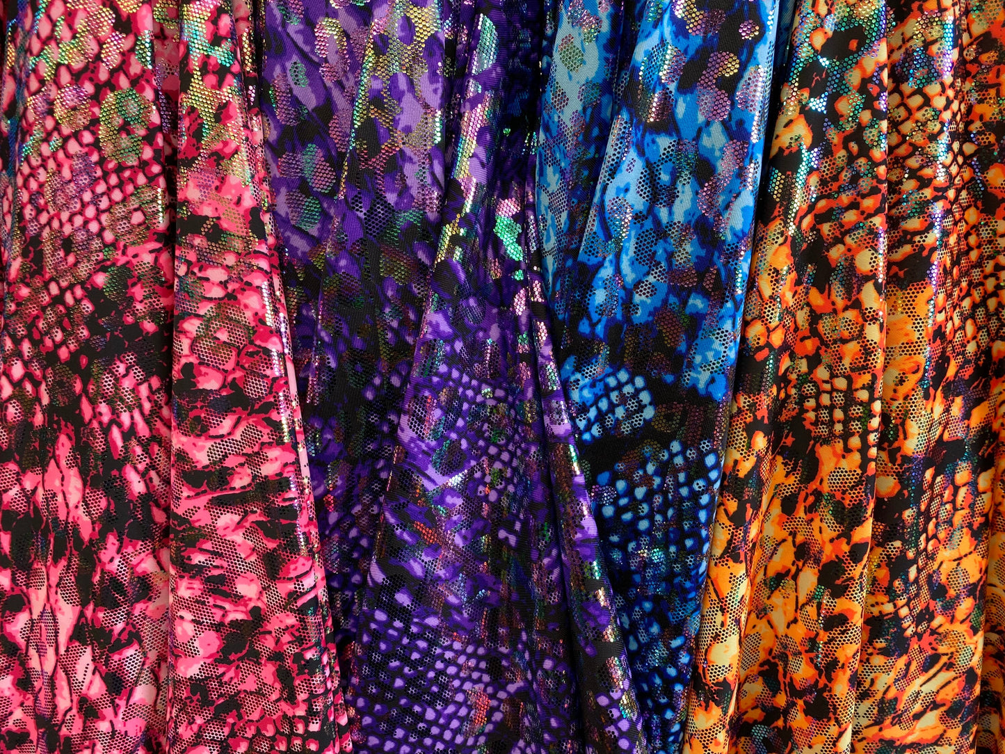 Iridescent metallic nylon spandex Cobra design 4way stretch 58/60” Sold by the YD. Ships worldwide from Los Angeles California USA