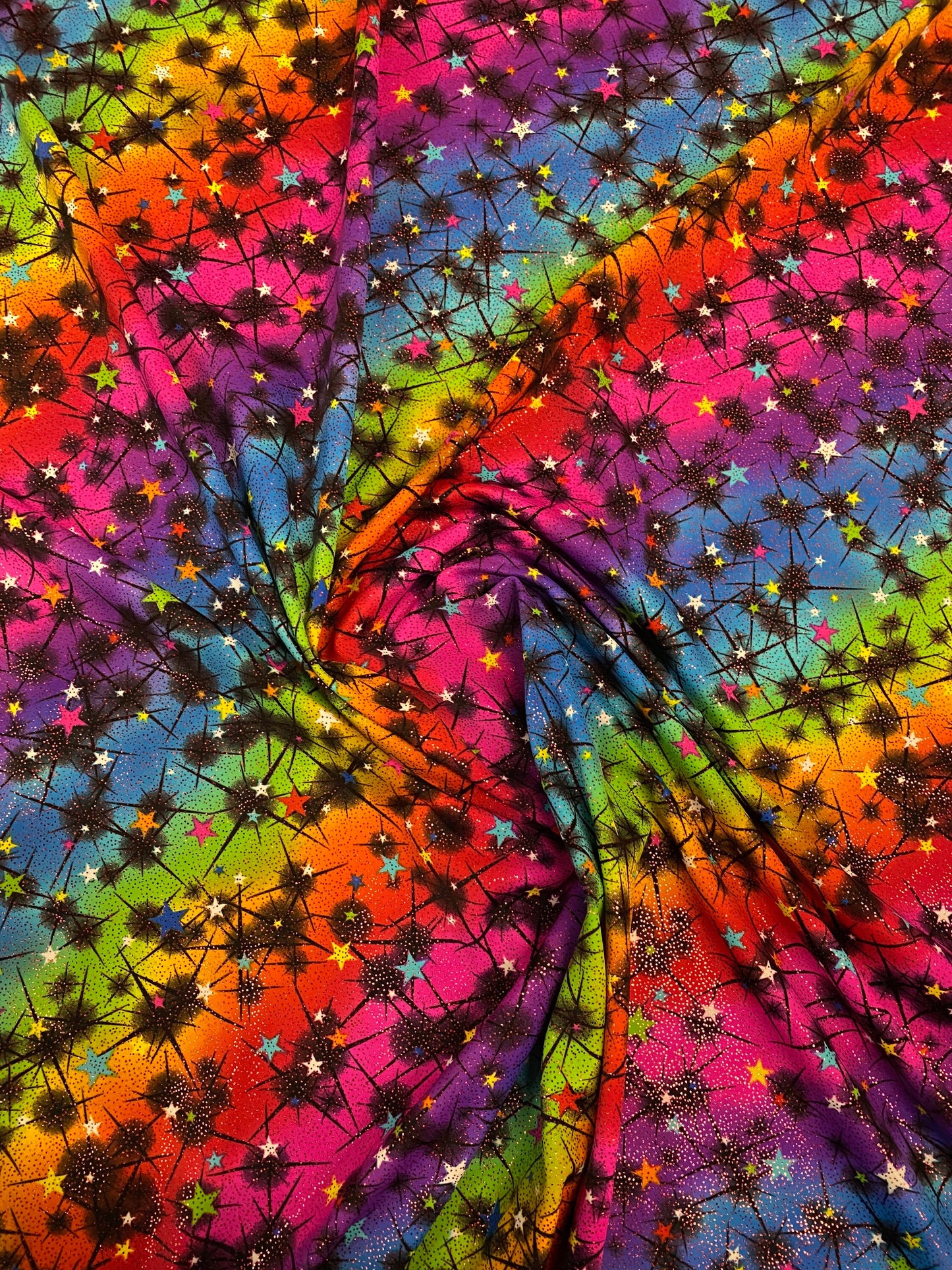 New rainbow Vegas design multi stars nylon spandex with foil 4-way stretch 58/60” Sold by the YD. Ships worldwide from Los Angeles CA USA.