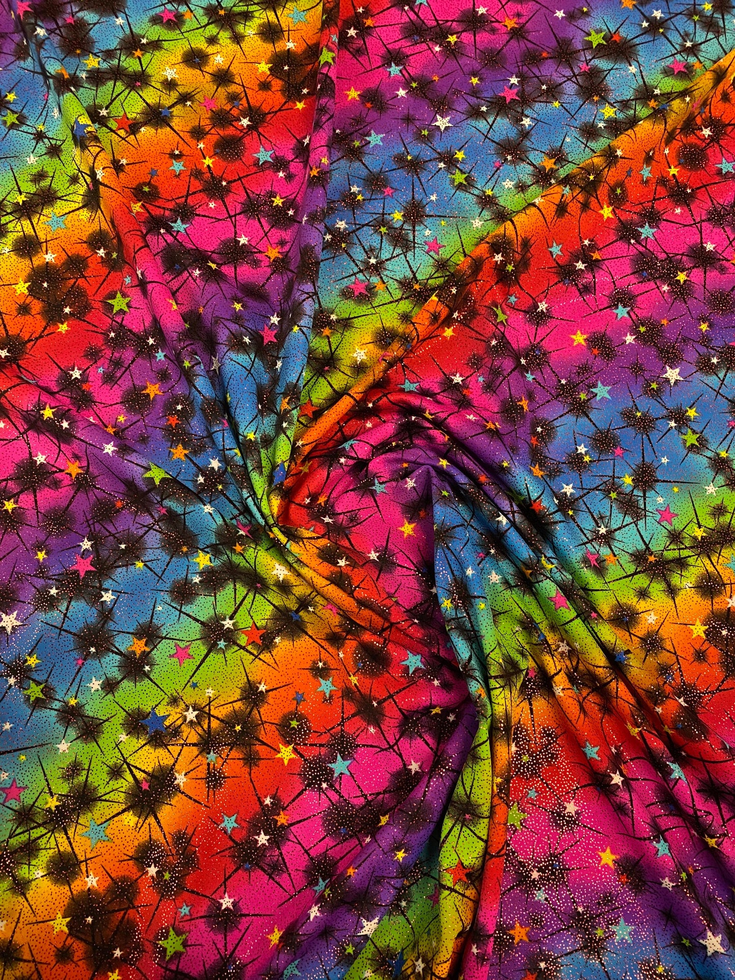 New rainbow Vegas design multi stars nylon spandex with foil 4-way stretch 58/60” Sold by the YD. Ships worldwide from Los Angeles CA USA.