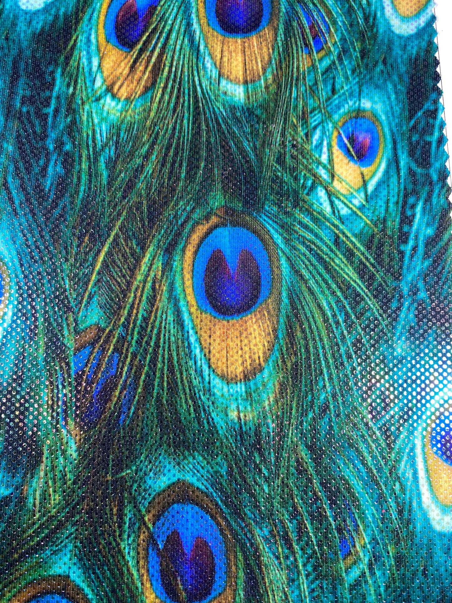 New peacock design reaction print on great quality of nylon spandex with clear foil dots 4-way stretch 58/60” Sold by the YD.