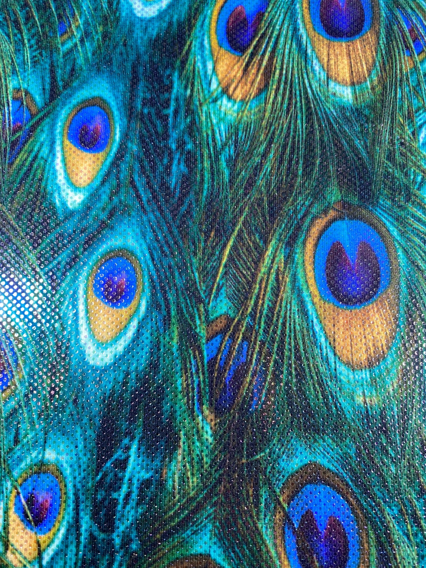 New peacock design reaction print on great quality of nylon spandex with clear foil dots 4-way stretch 58/60” Sold by the YD.