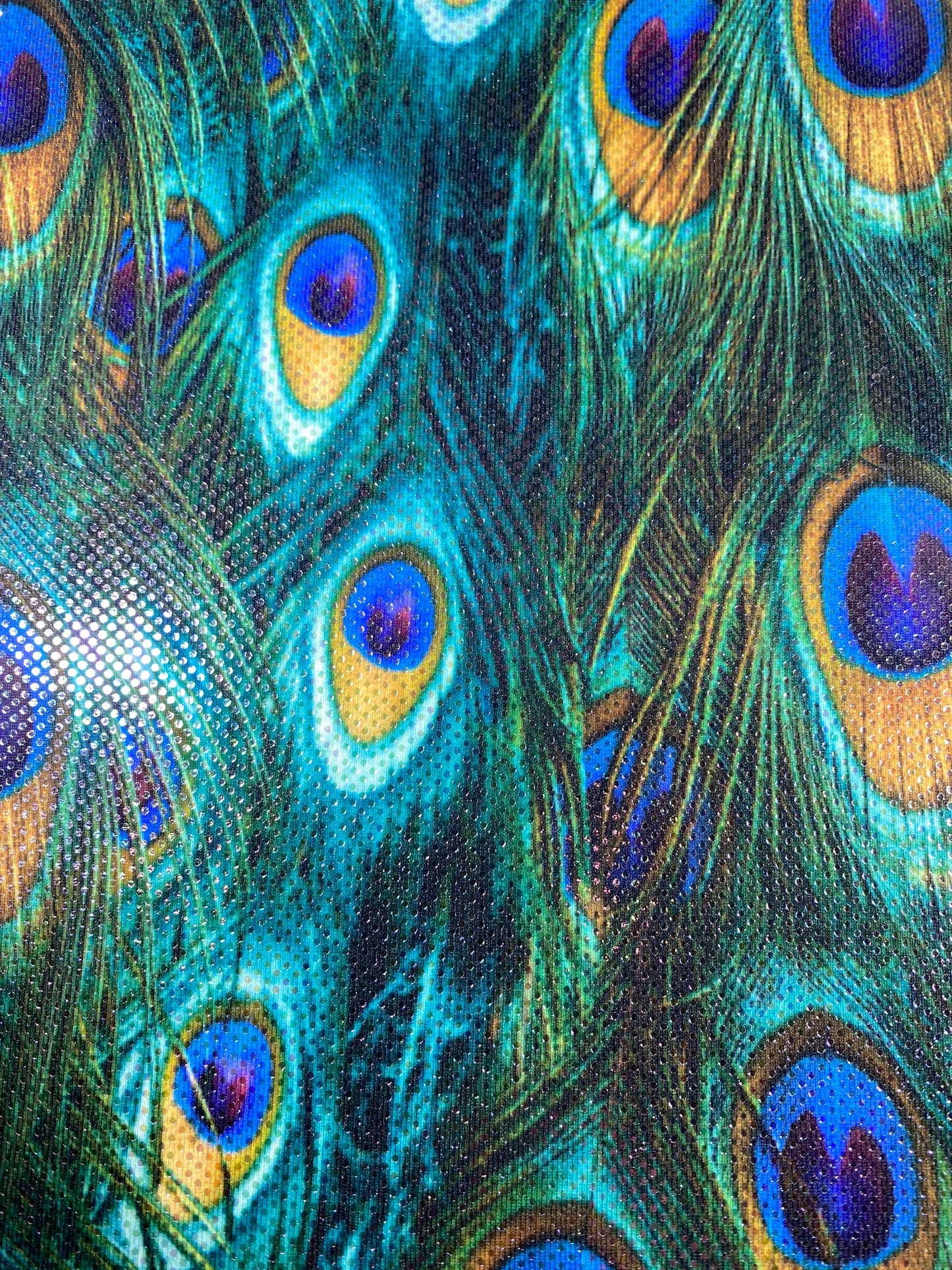 New peacock design reaction print on great quality of nylon spandex with clear foil dots 4-way stretch 58/60” Sold by the YD.