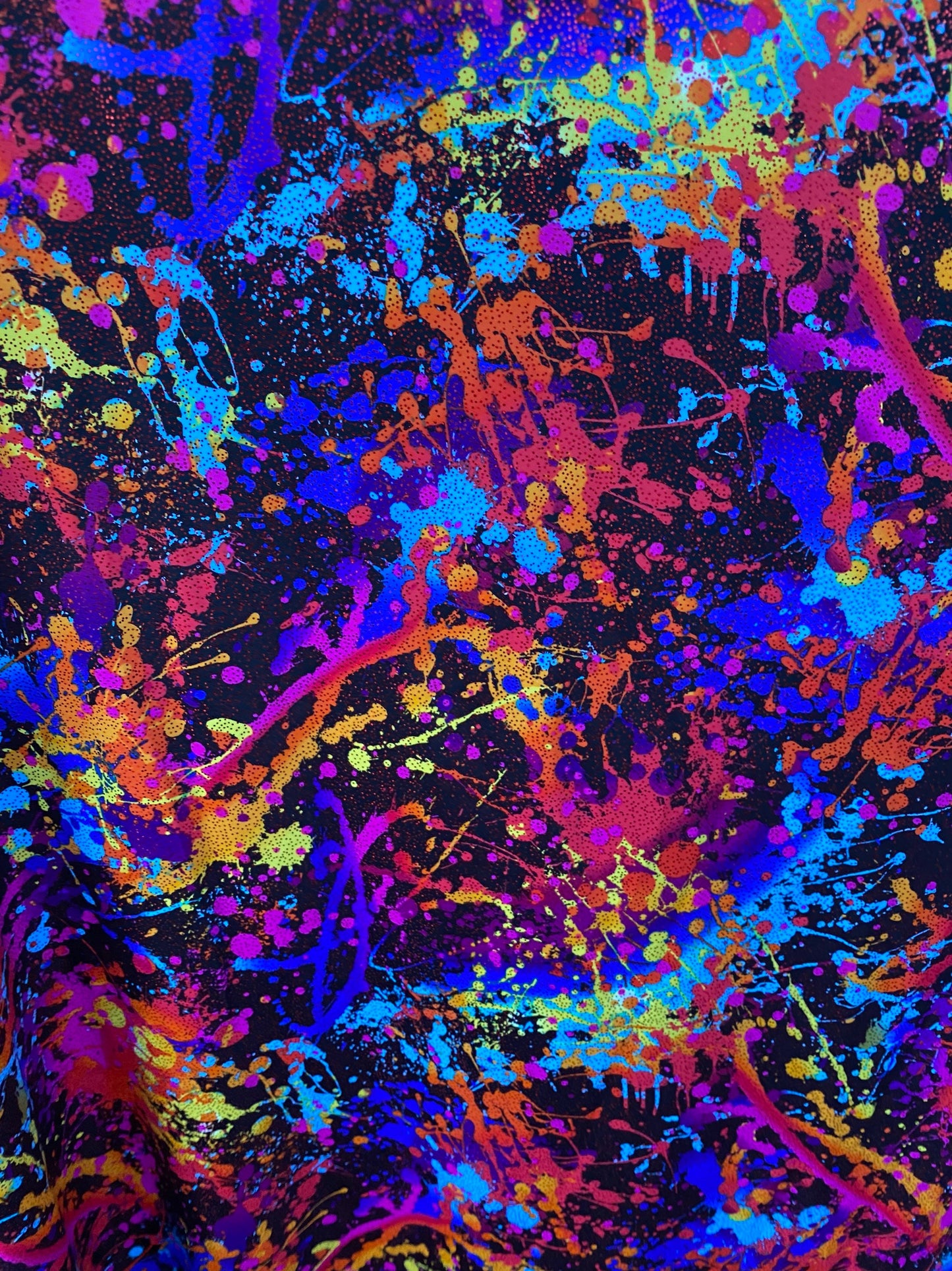 Graffiti paint design multi nylon spandex with foil 4-way stretch 58/60” sold by the YD. Ships worldwide from Los Angeles California.