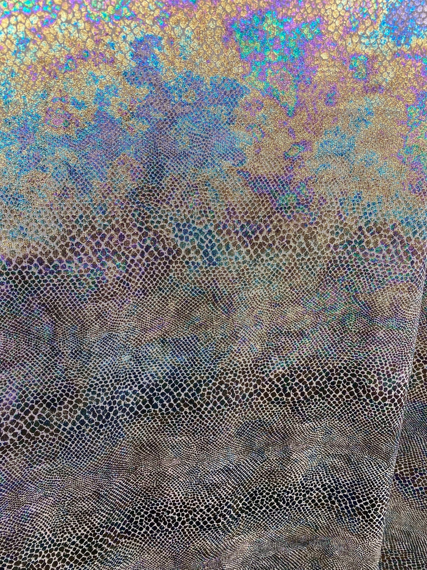 New Iridescent snake design print on silver poly mesh 2-way Stretch 58/60” Sold by the YD. Ships Worldwide from Los Angeles California USA.