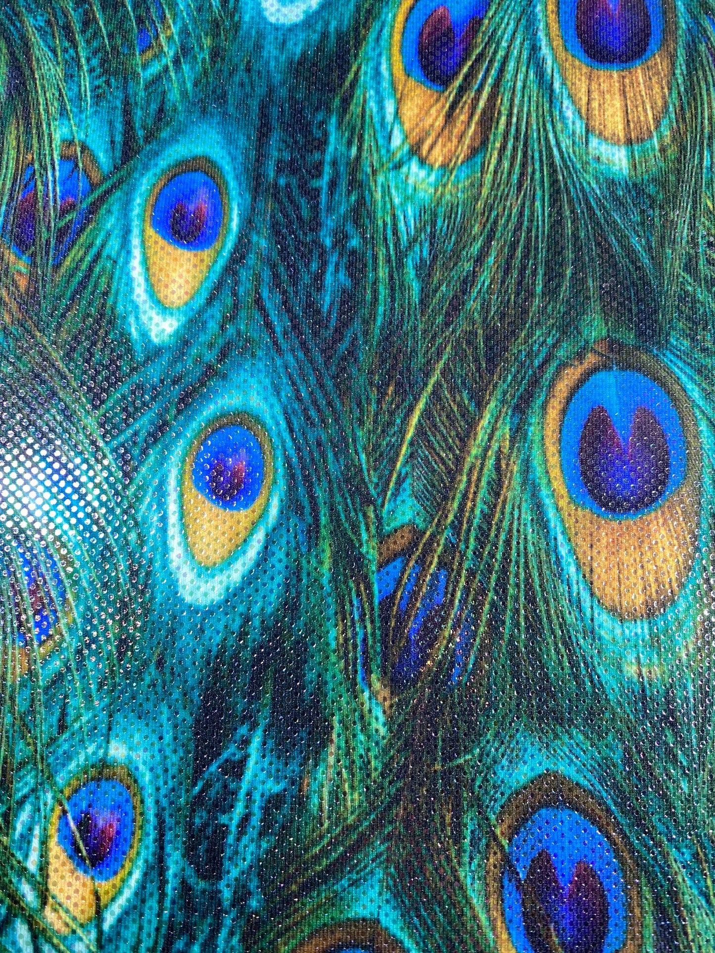 New peacock design reaction print on great quality of nylon spandex with clear foil dots 4-way stretch 58/60” Sold by the YD.