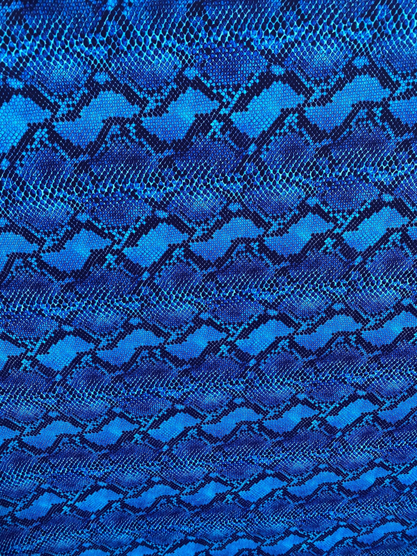 Serpent design Sapphire/Black print on nylon spandex 4-way stretch 58/60” Sold by the YD. Ships worldwide from Los Angeles California USA.