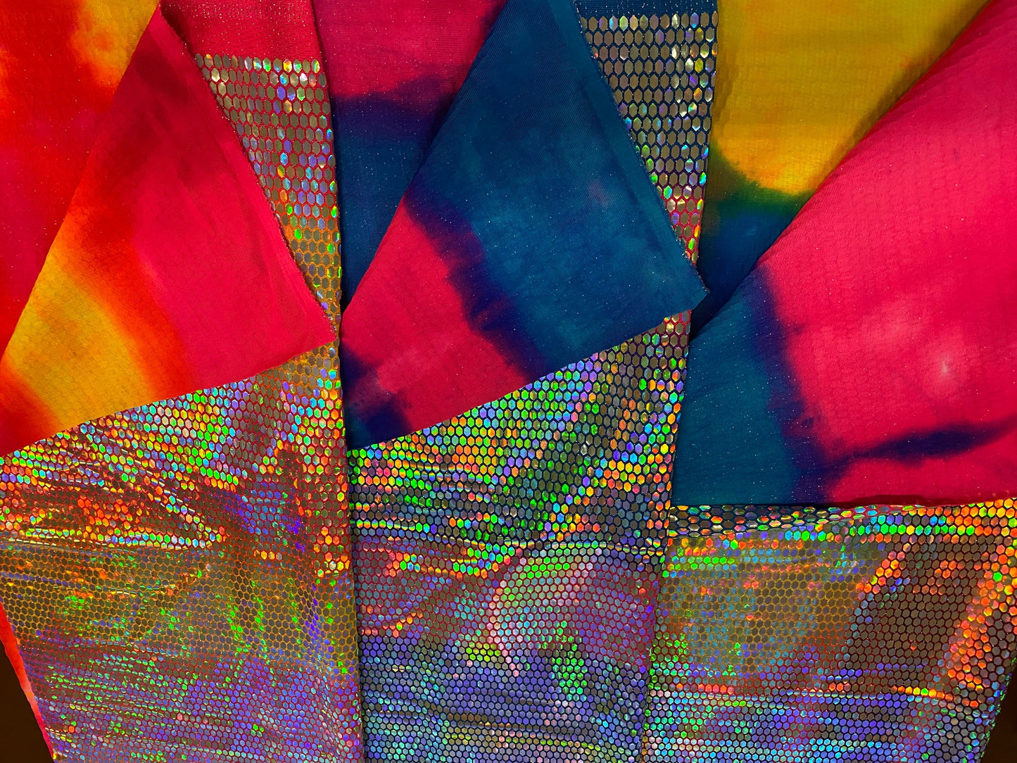 Hexagon tie dye Hologram sequins trans on Nylon metallic 2-way stretch 58/60” Sold by the YD. Ships worldwide from Los Angeles
